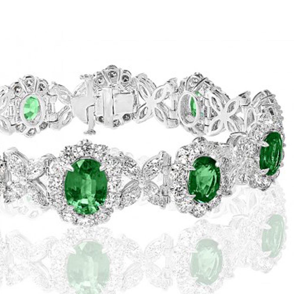 Incredible emerald and diamond bracelet. There are 10 oval brilliant cut emeralds totaling 10.27 ct. There are 40 Marquis cut diamonds totaling 4.87 ct and 102 round brilliant cut diamonds totaling 8.59ct. The total diamond weight between the two