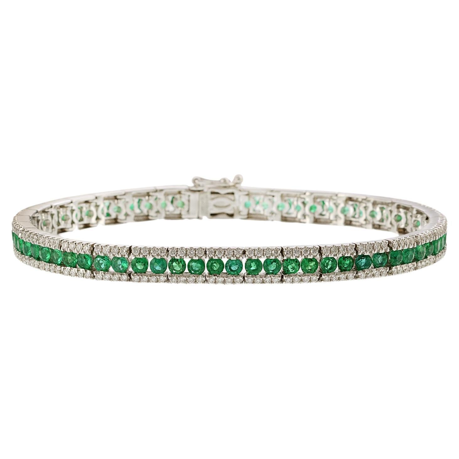 Bracciale in oro bianco 18KT con diamanti taglio rotondo e smeraldi