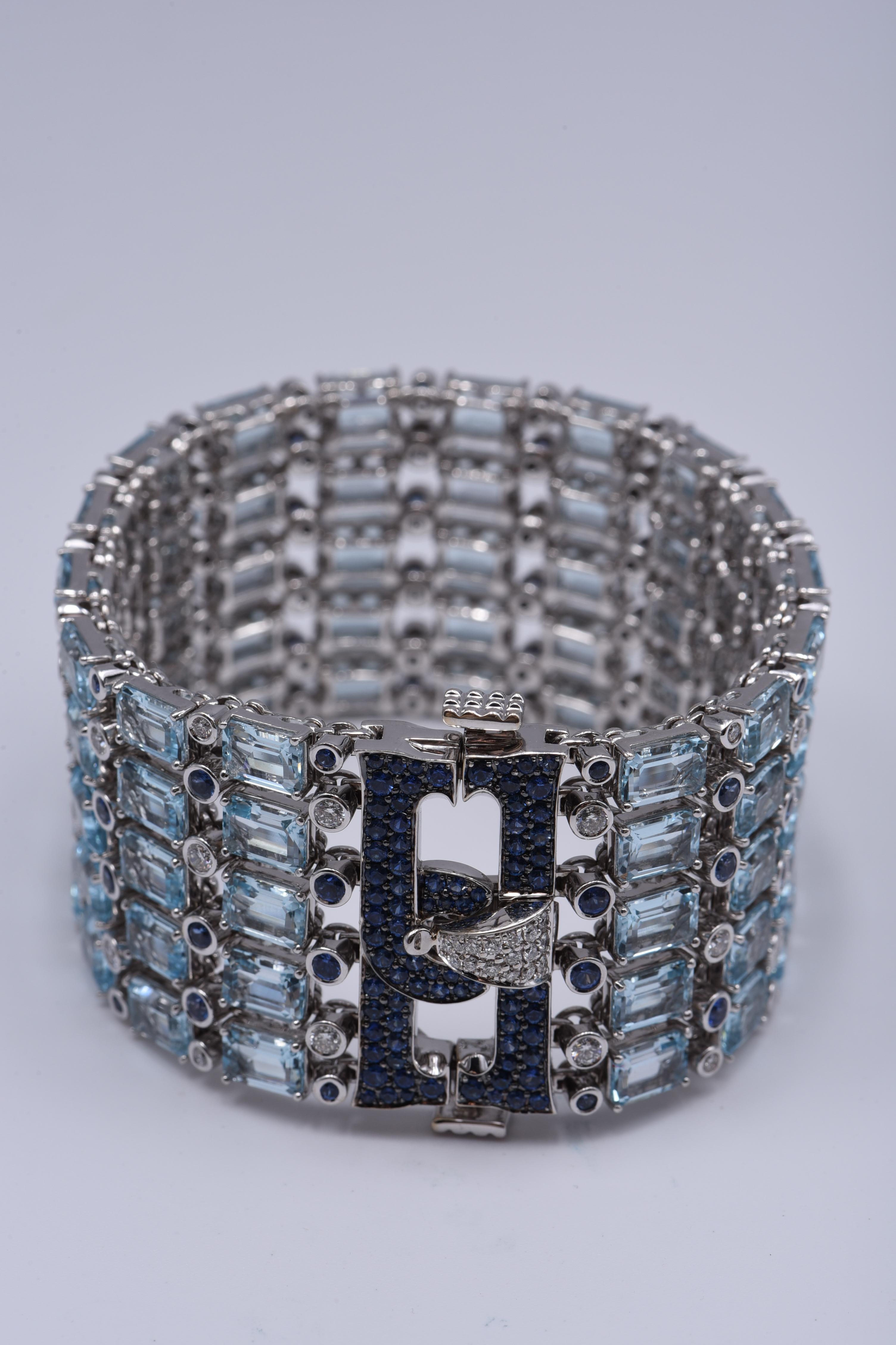 Round Cut 18KT White Gold Bracelet with White Diamonds, Blue Sapphires, and Blue Topaz For Sale