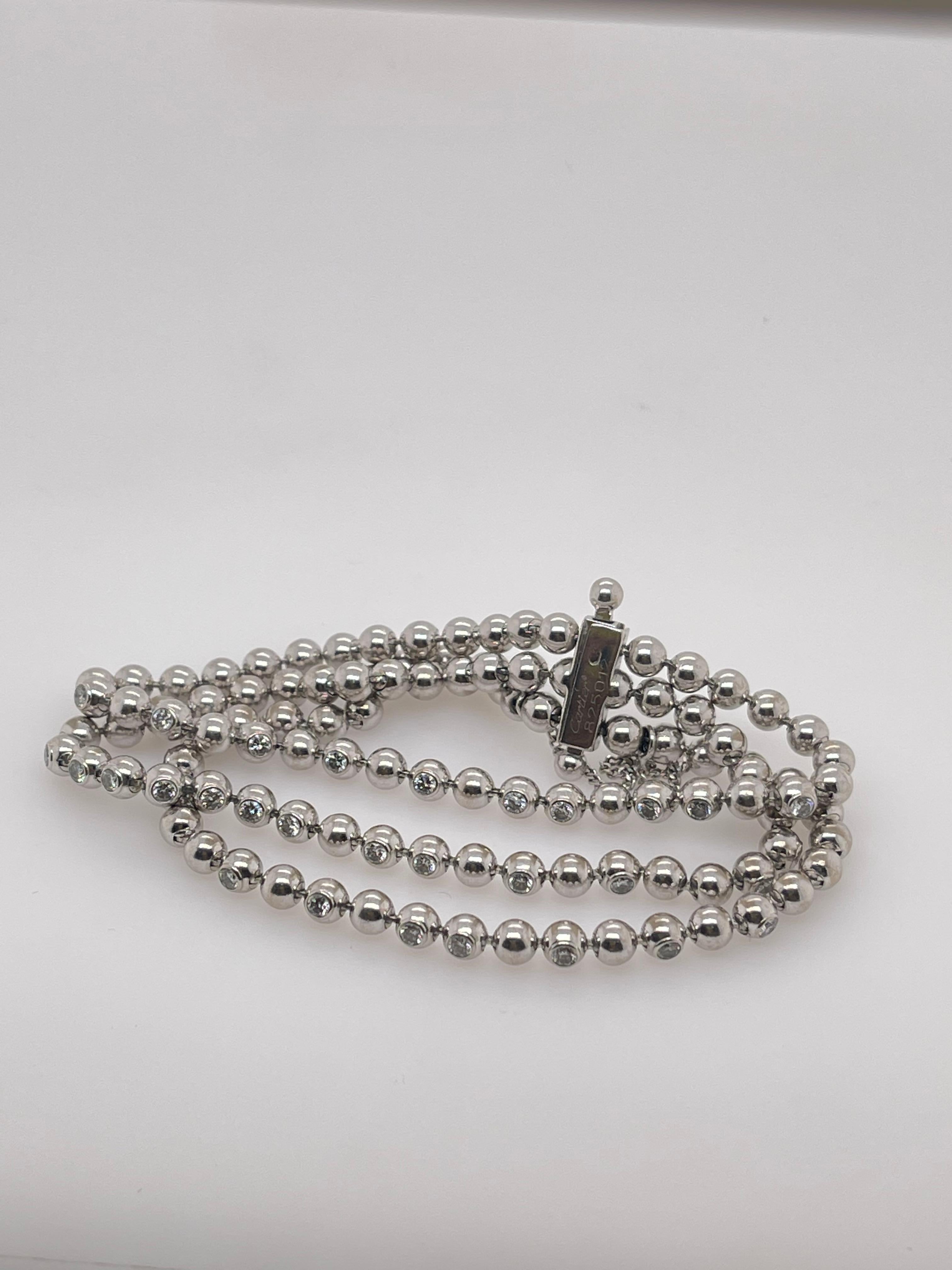 Cartier - Bracelet Perles de Diamants 3 rangs en or blanc
or blanc 18kt 
Bracelet à maillons serti de 3 rangées de diamants 

