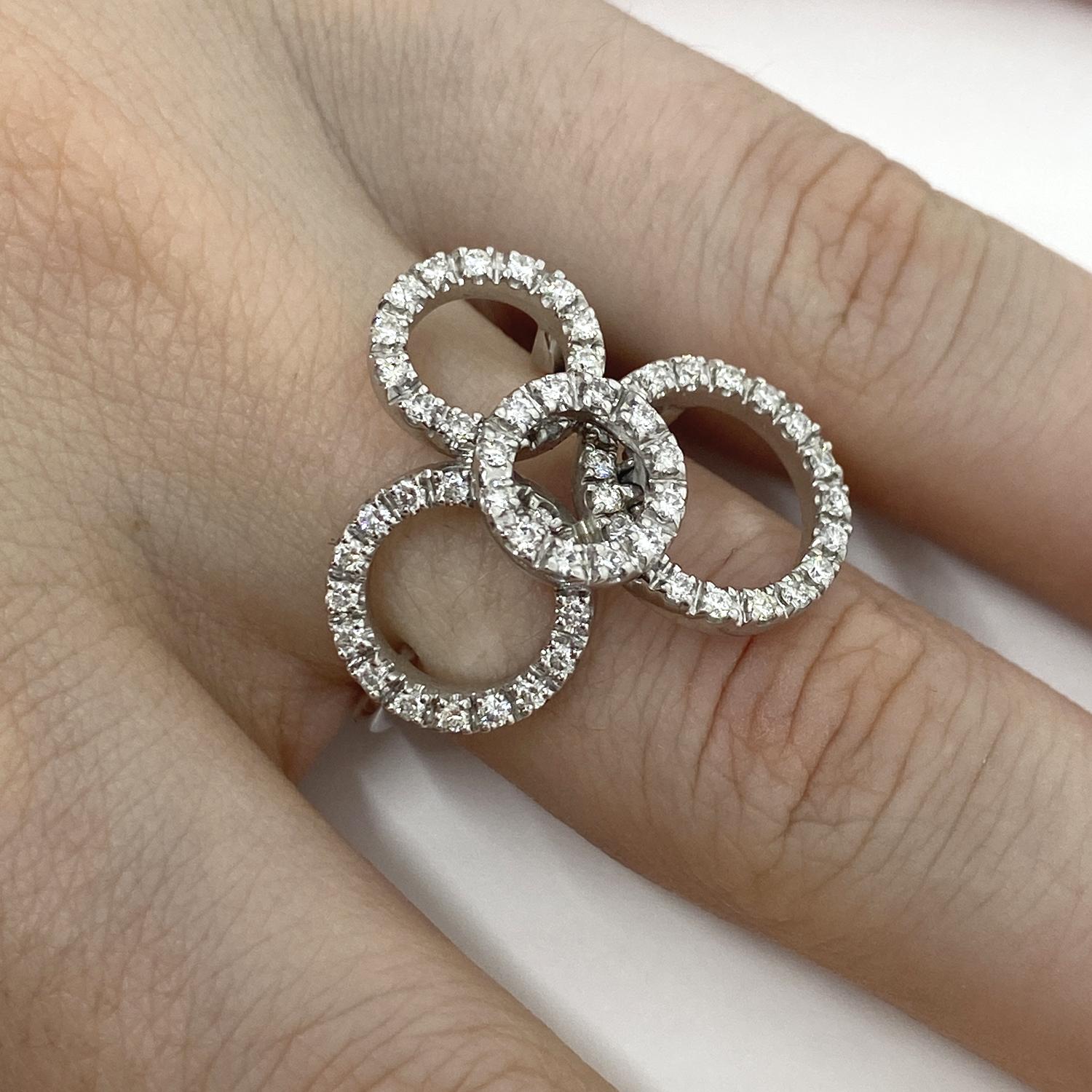 Modern ring made of 18kt white gold with four pavé circles of natural white brilliant-cut diamonds for ct.0.79
-------------------------------------------------

Important Note : In order to speed up the publishing process of our vast inventory,