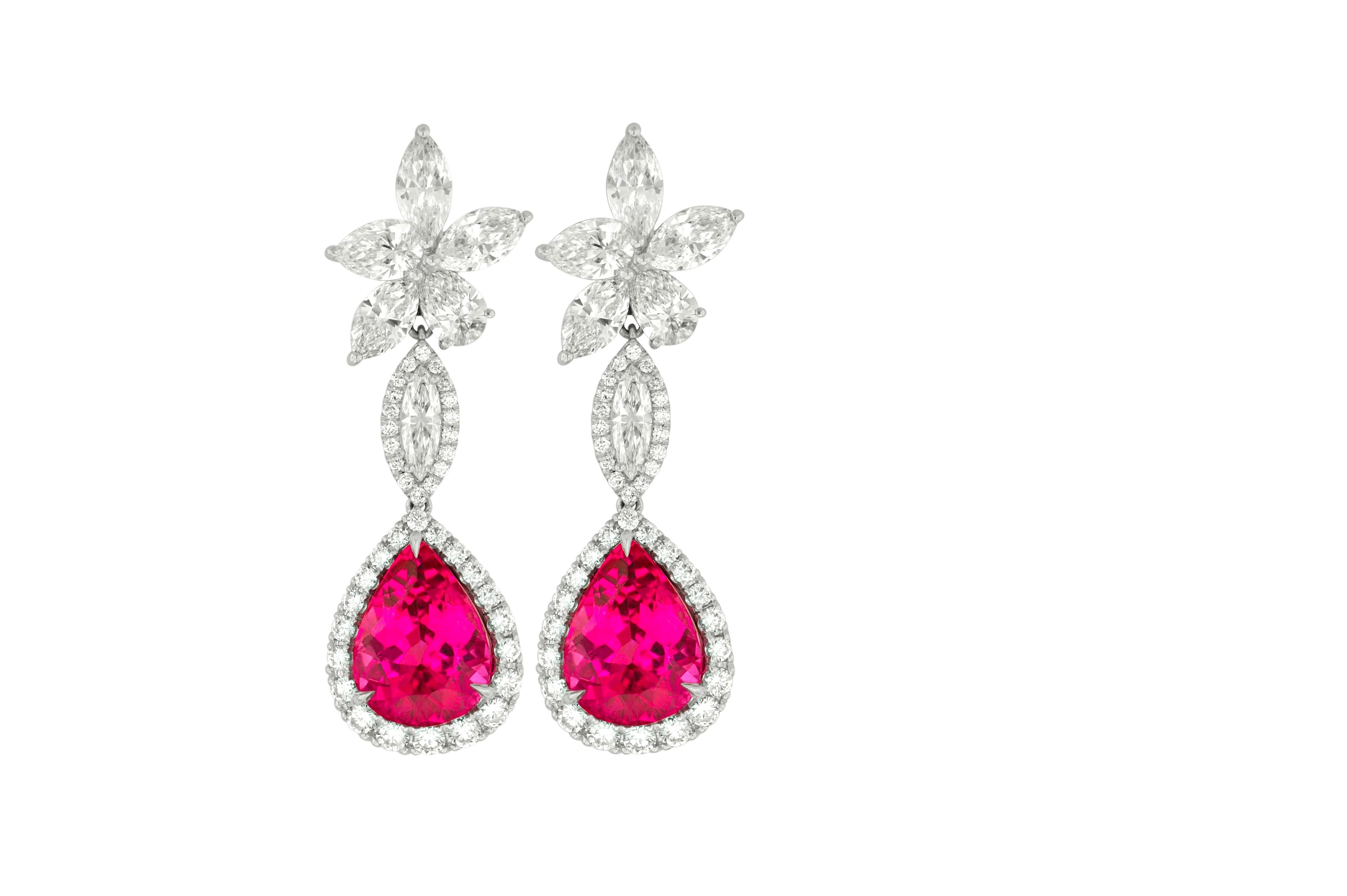 18kt white gold cluster pink tourmaline and diamonds earrings, features 12.70 (6.02+6.68ct) of two pink tourmalines and 10.15ct of 6 mq & rd diamonds.
