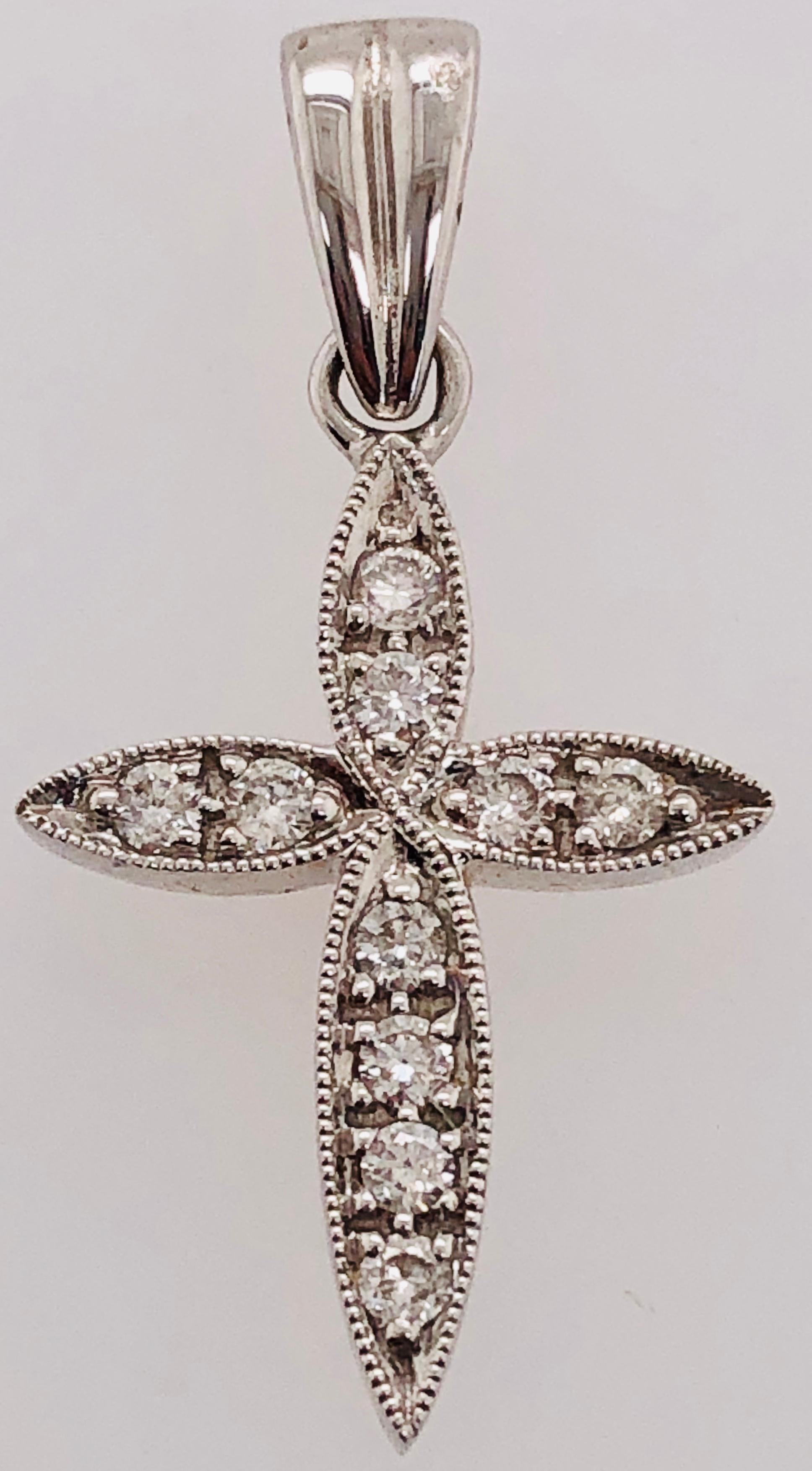 18Kt white Gold Cross Diamond Pendant 0.18 Total Diamond Weight
2.31 grams total weight