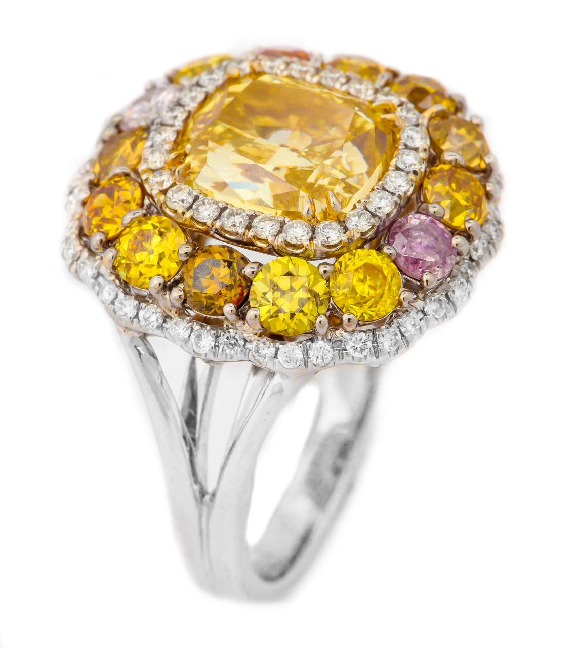 18kt white gold cushion cut diamond ring with center GIA certified 3.02 fancy yellow brownish -vs1 in clarity cushion cut diamond (radc889) set with 4.12 ct of fancy color diamonds all around.
