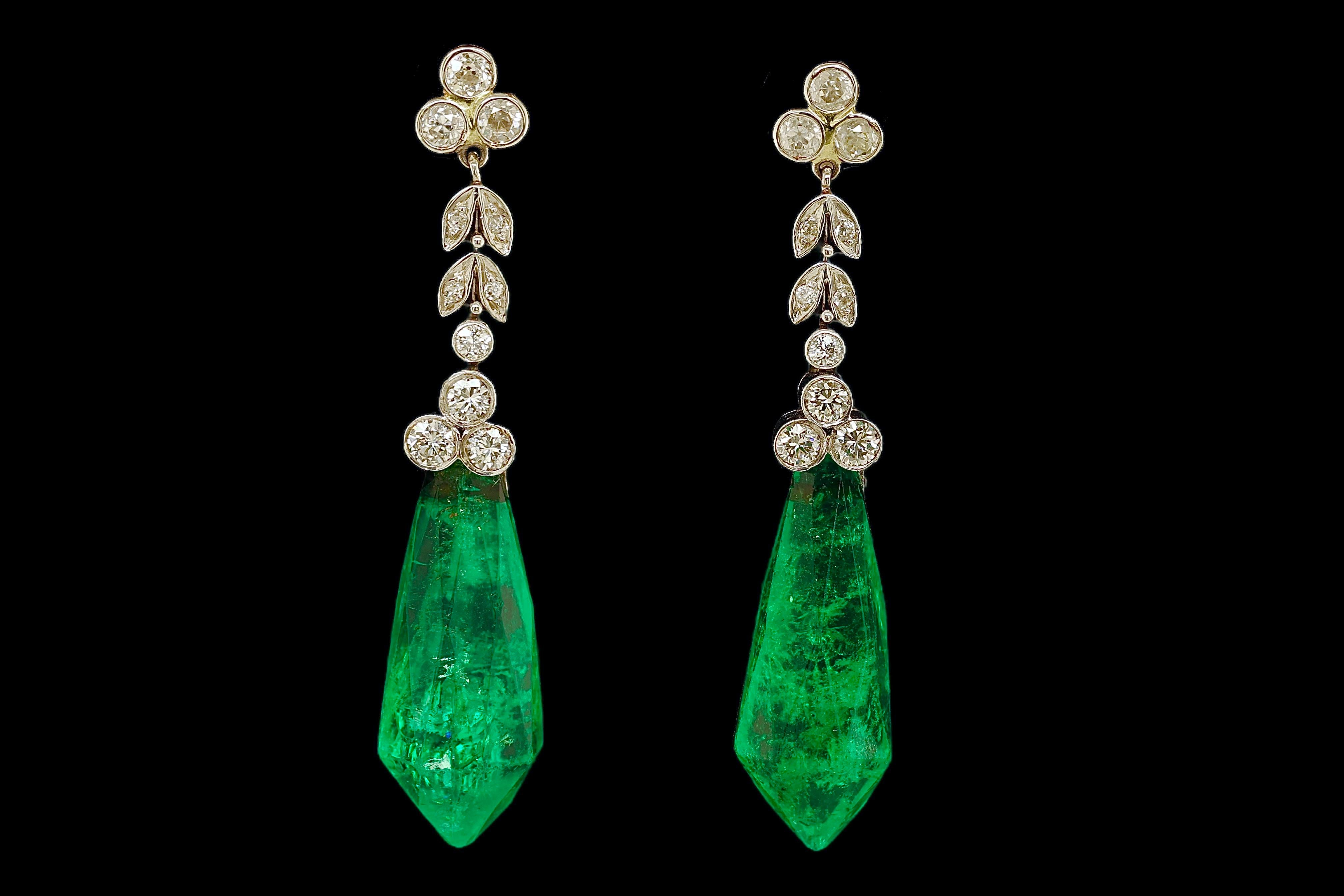 Gorgeous 18kt White Gold Dangling Earrings With 32 ct Emeralds and 1.46 ct Diamonds, Estate Sultan Of Oman Qaboos Bin Said

Emerald: Collectors Rare 2 Natural Emeralds faceted , Fancy green, together approx. 32 ct. 
Comes with GRS certificate