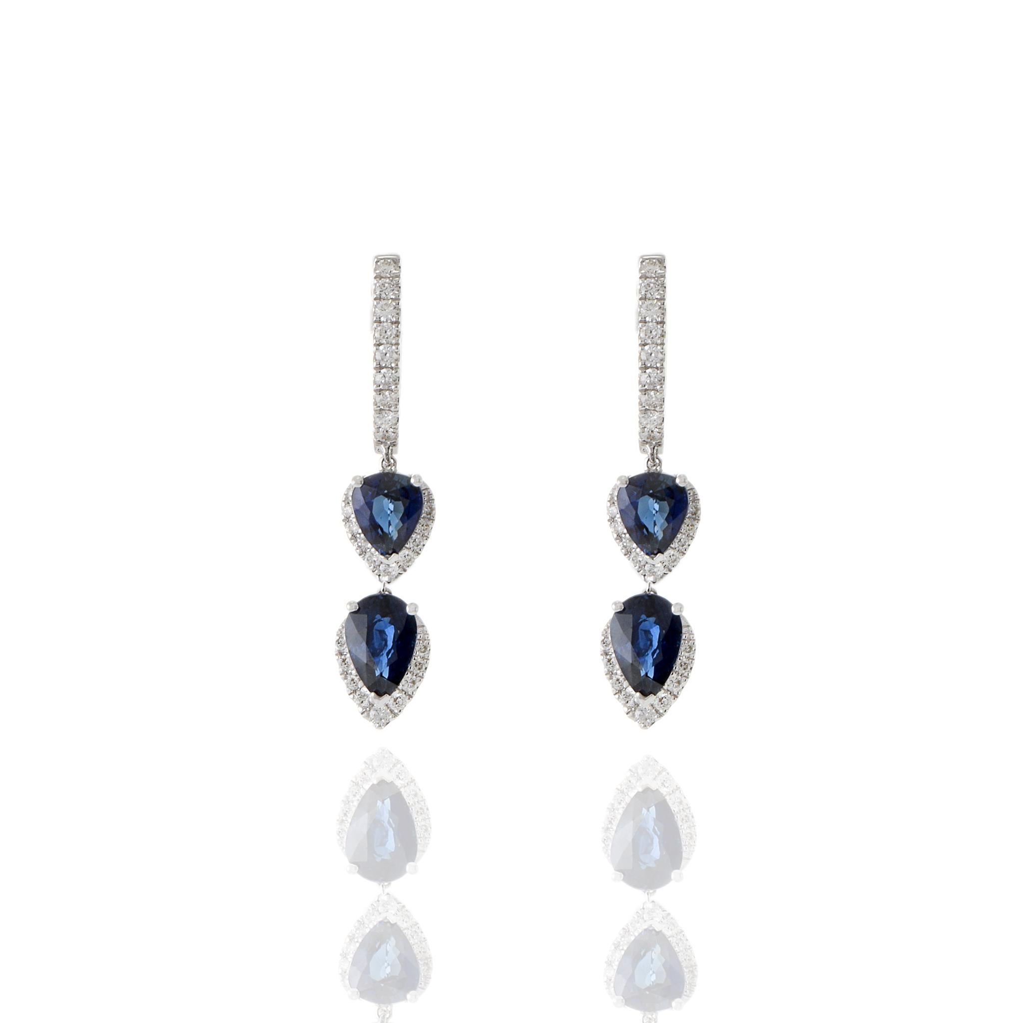 Modern 18KT White Gold Diamond And Blue Sapphire Drop Earrings For Sale
