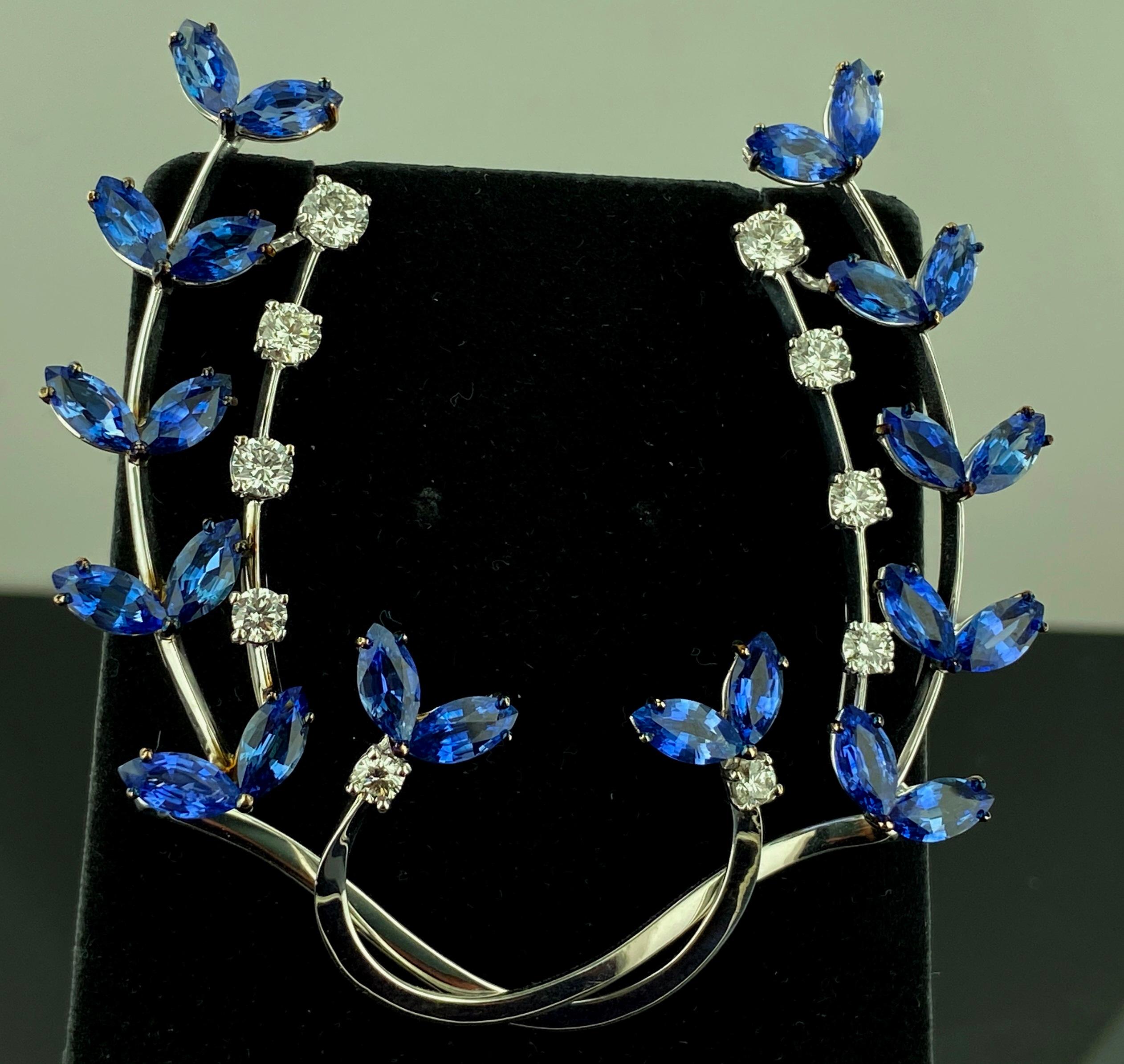 Set in 18 karat white gold are 24 Marquise cut blue Sapphires with a total weight of 9.78 carats along with 10 round brilliant cut diamonds with a total weight of 1.50 carats.  Italy.