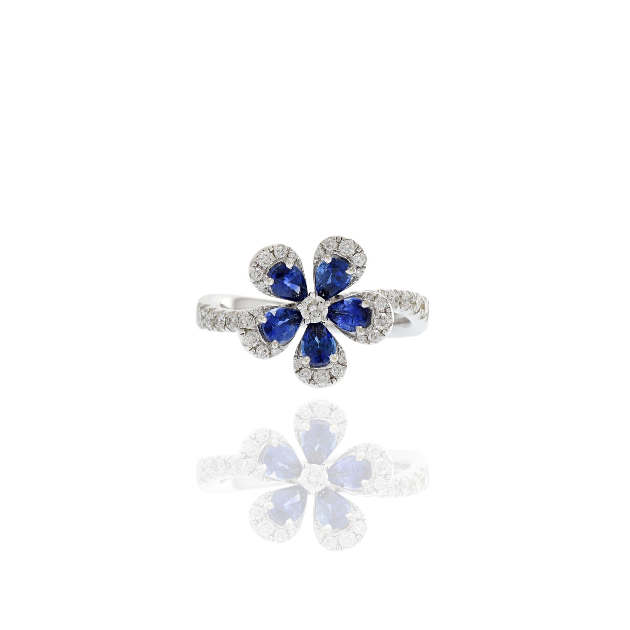Modern 18KT White Gold Diamond And Sapphire Flower Ring For Sale