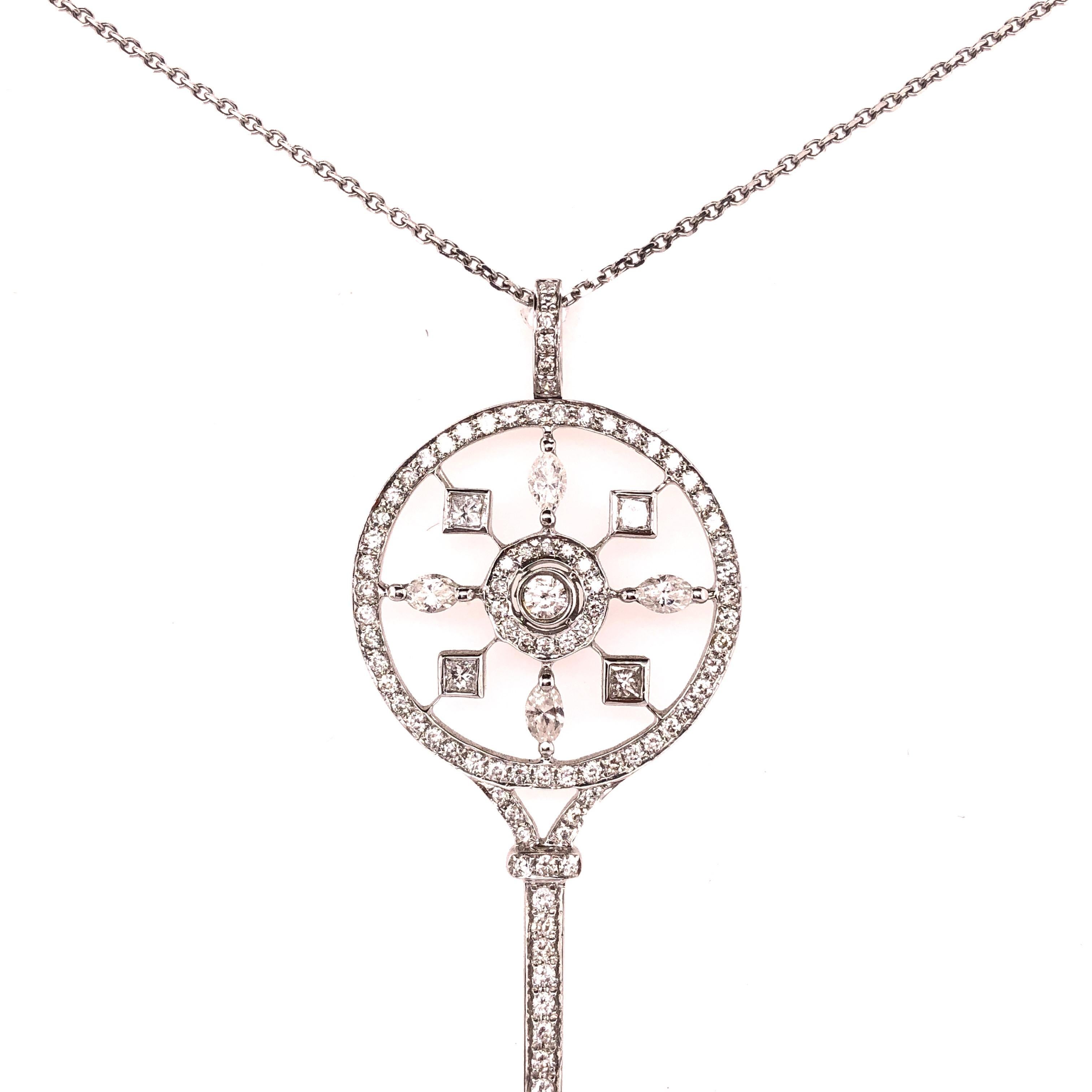 18Kt White Gold & Diamond Key Pendant Necklace, in the manner of Tiffany and Company on a 14KT White gold chain. Petals key pendant stamped 750 with round brilliant diamonds. The pendant itself measuring a large and impressive. 65.5 mm high by 21.75