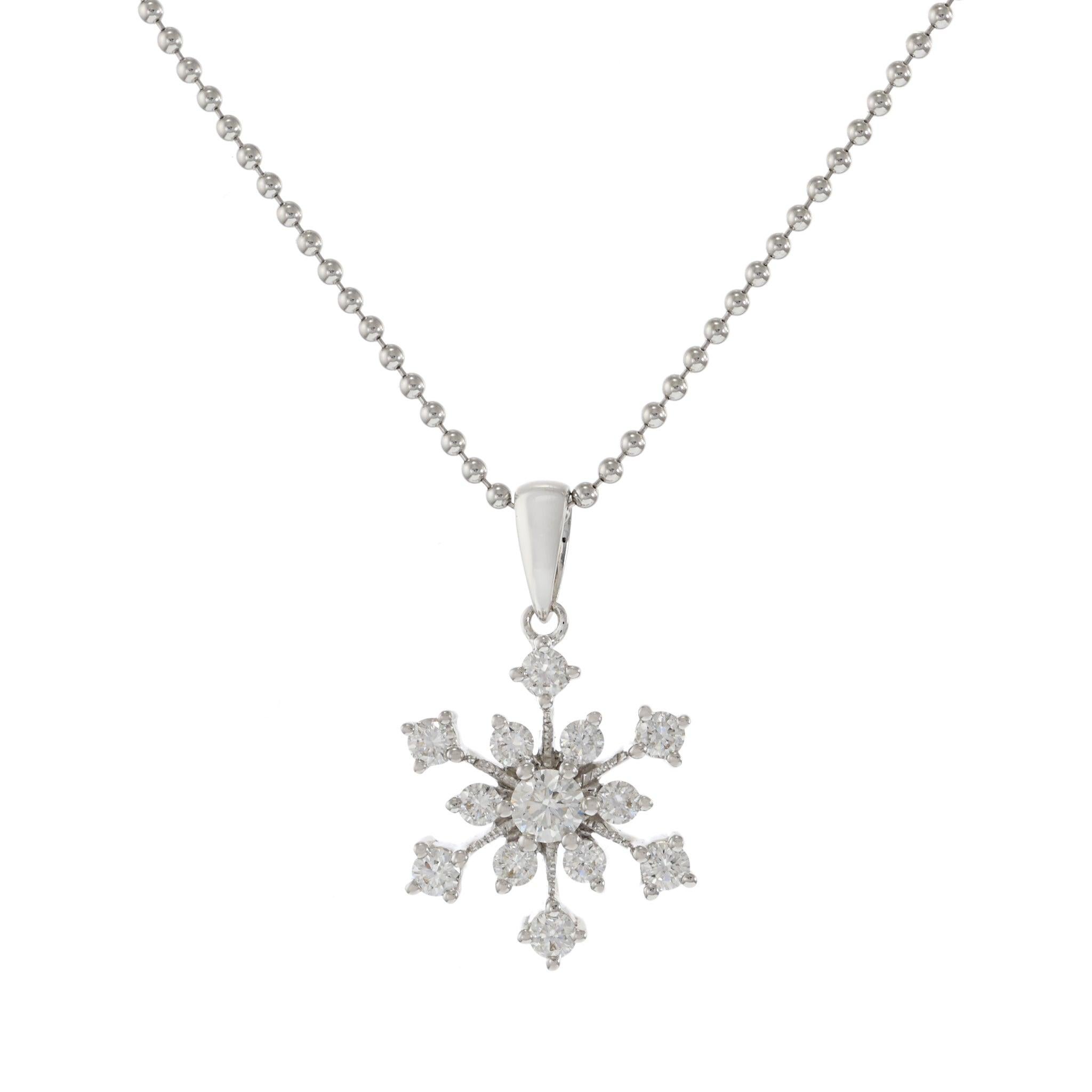 This exquisite pendant features a delicate snowflake design, crafted in 18KT white gold. It is adorned with 0.34 carats of round brilliant cut diamonds, with G color and VS1-VS2 clarity. The intricate snowflake pattern adds a touch of winter