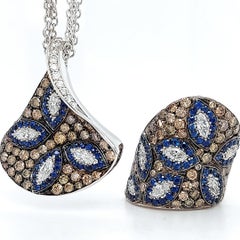 18 Karat White Gold Dome Ring with Sapphire and 3.85 Carat White, Brown Diamonds