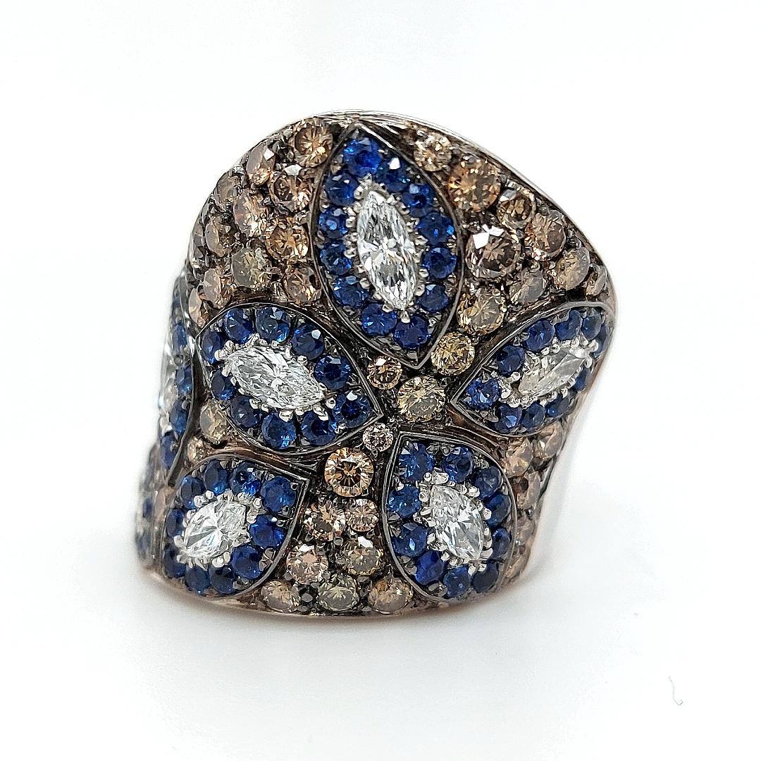 18kt solid White Gold Dome Ring With Sapphire & 3.85 Carat White, Brown Diamonds 

Amazing handcrafted diamond and sapphires ring ,possible to get a matching pendant as well !

Diamonds: Brown, White brilliant cut diamonds  and marquise cut diamonds