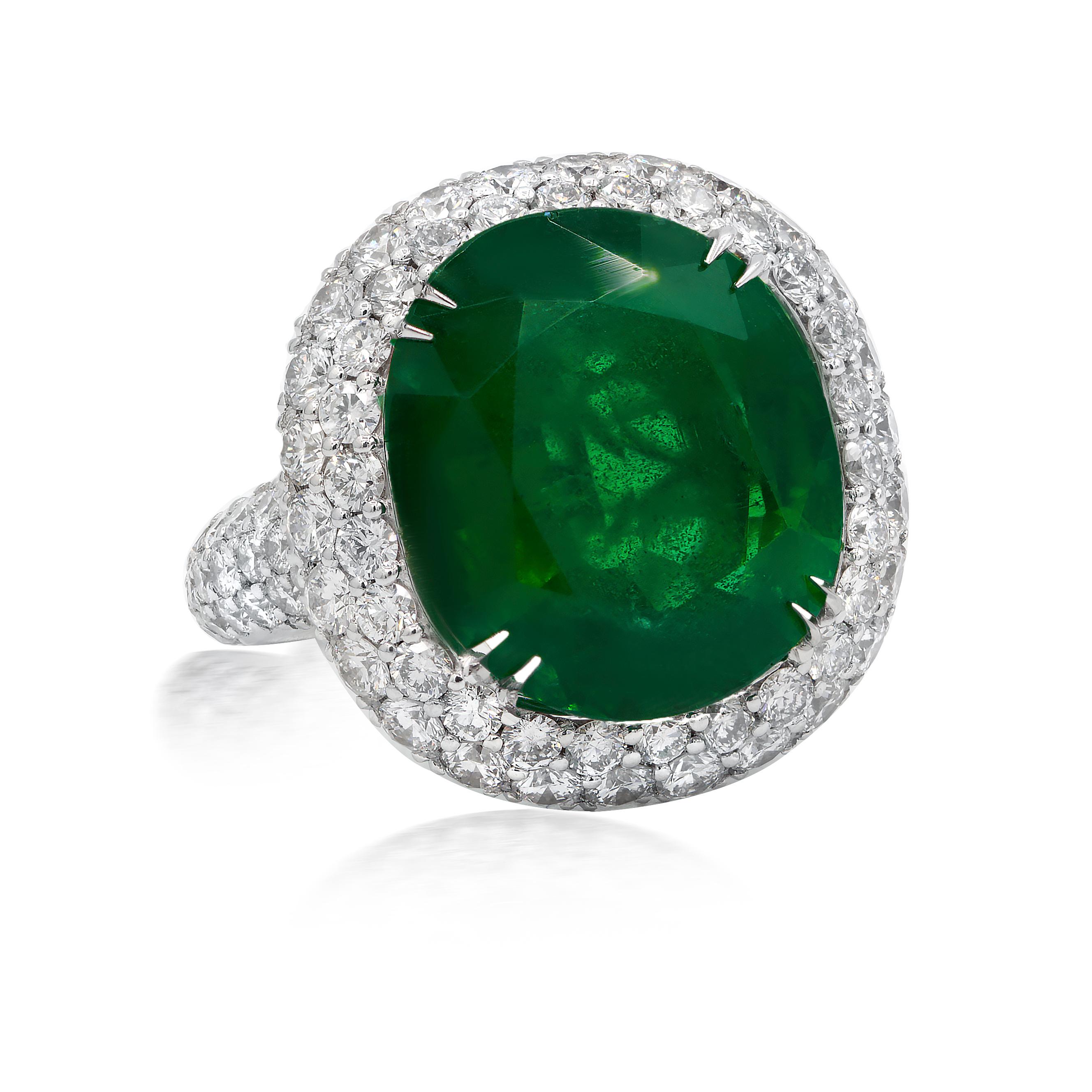18kt white gold double halo green oval emerald diamond ring features 10.95cts green emerald with 4.50cts of diamonds
