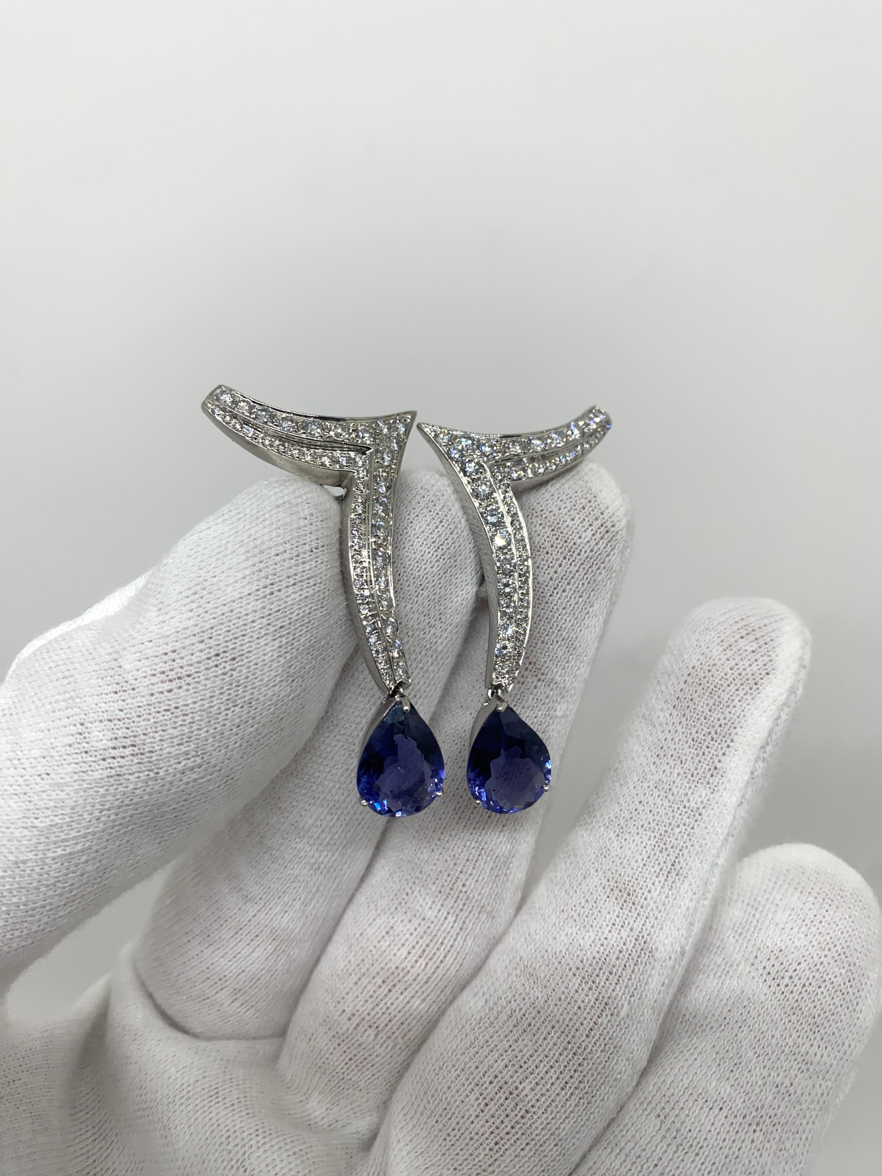 Dangling earrings made of 18kt white gold with natural drop-cut iolites for ct.5.20 and pavé natural white brilliant-cut diamonds for ct.1.90

Welcome to our jewelry collection, where every piece tells a story of timeless elegance and unparalleled