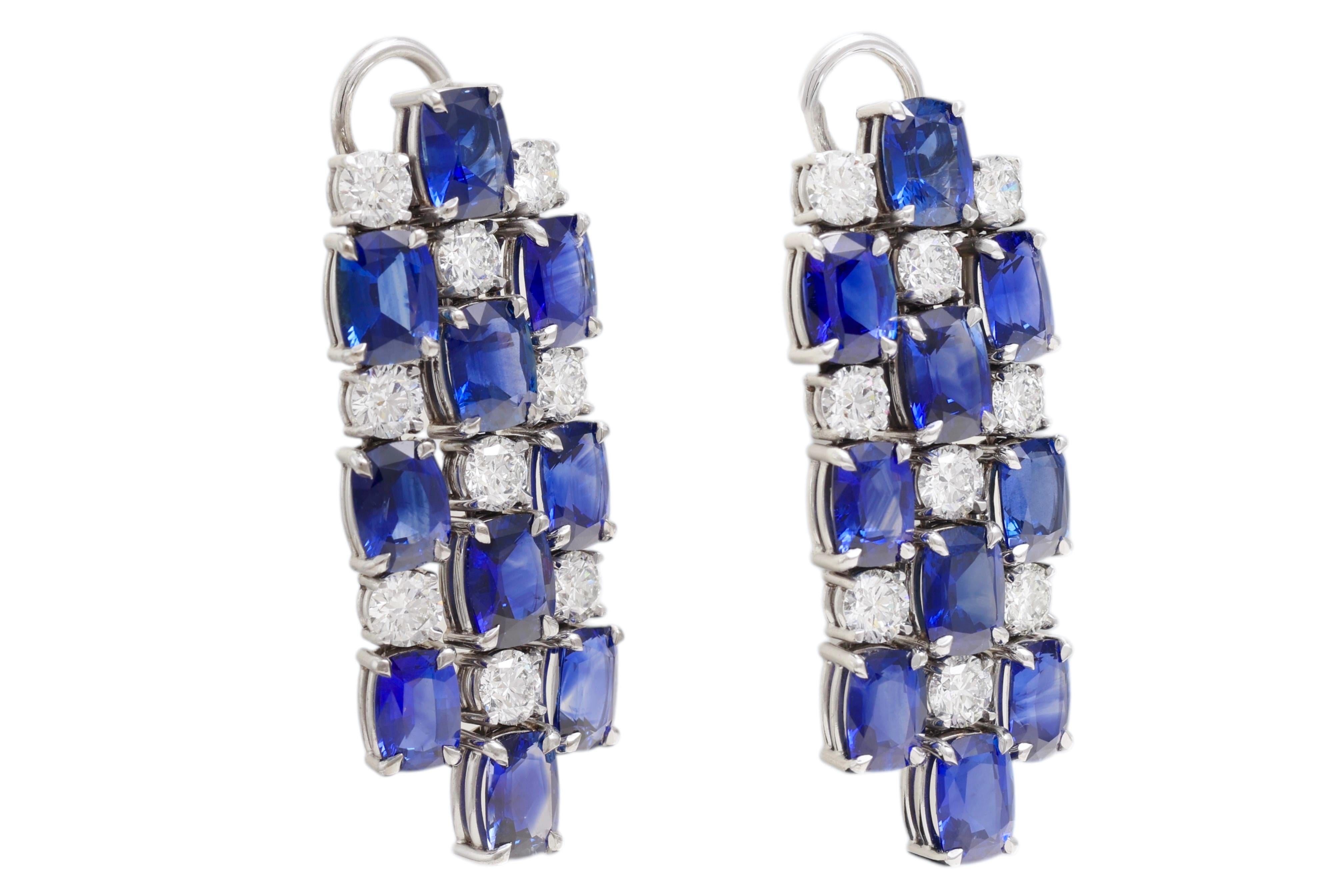 18kt White Gold Earrings with 21.42ct Sapphires, 5.09ct Diamonds, CGL Certified

Extremely nice sapphire and diamond earrings.

Sapphires: 20 Ceylon/Madagascar sapphires together 21.42 carat in total. Vivid blue, Cushion shape, Variety of corundum
