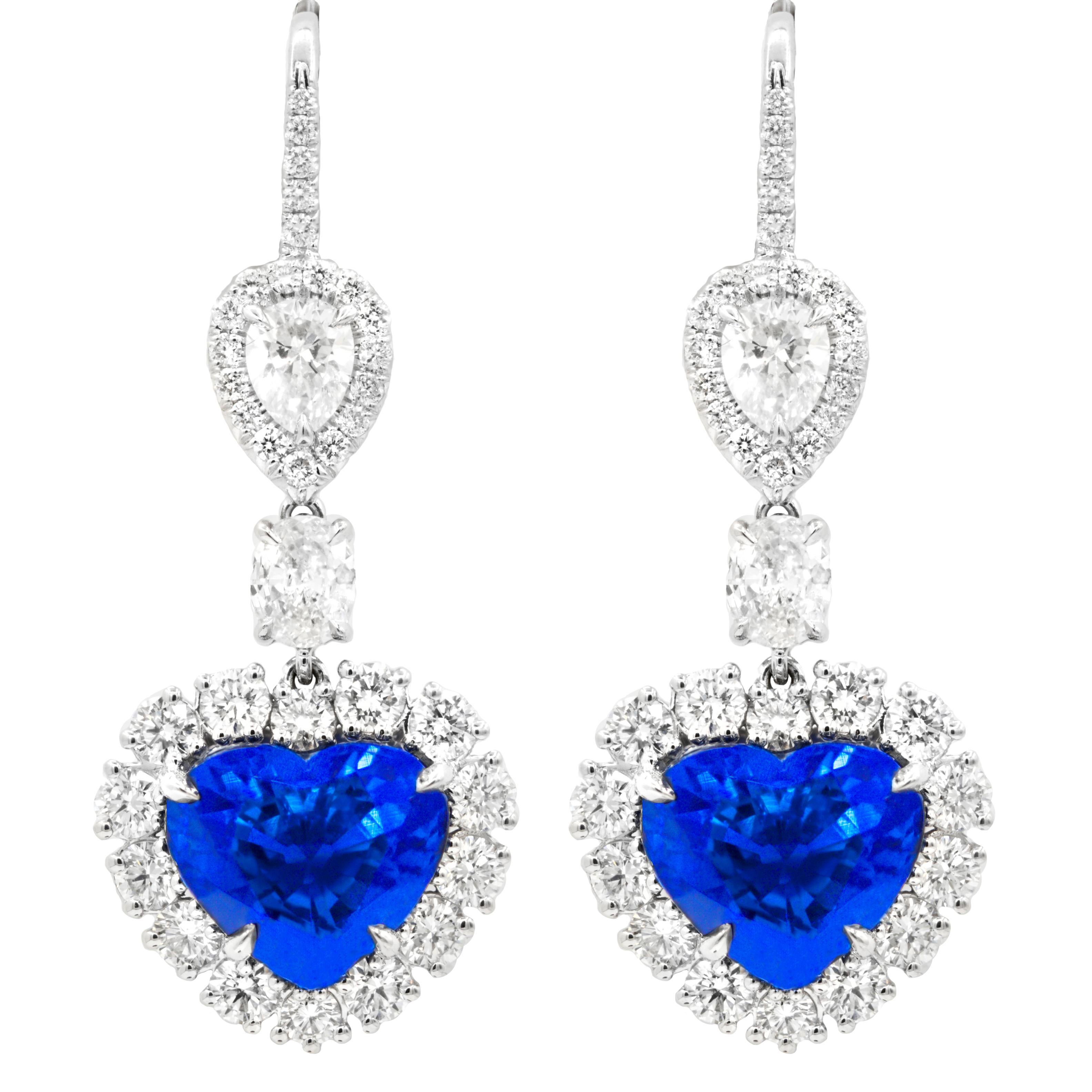 18kt white gold AGL certified heart shape sapphire earrings weighing 12.74 cts; oval and pear shape diamond in a halo  weighing total of 5.00ct of white diamonds set all the way around with  f-gvs color.
