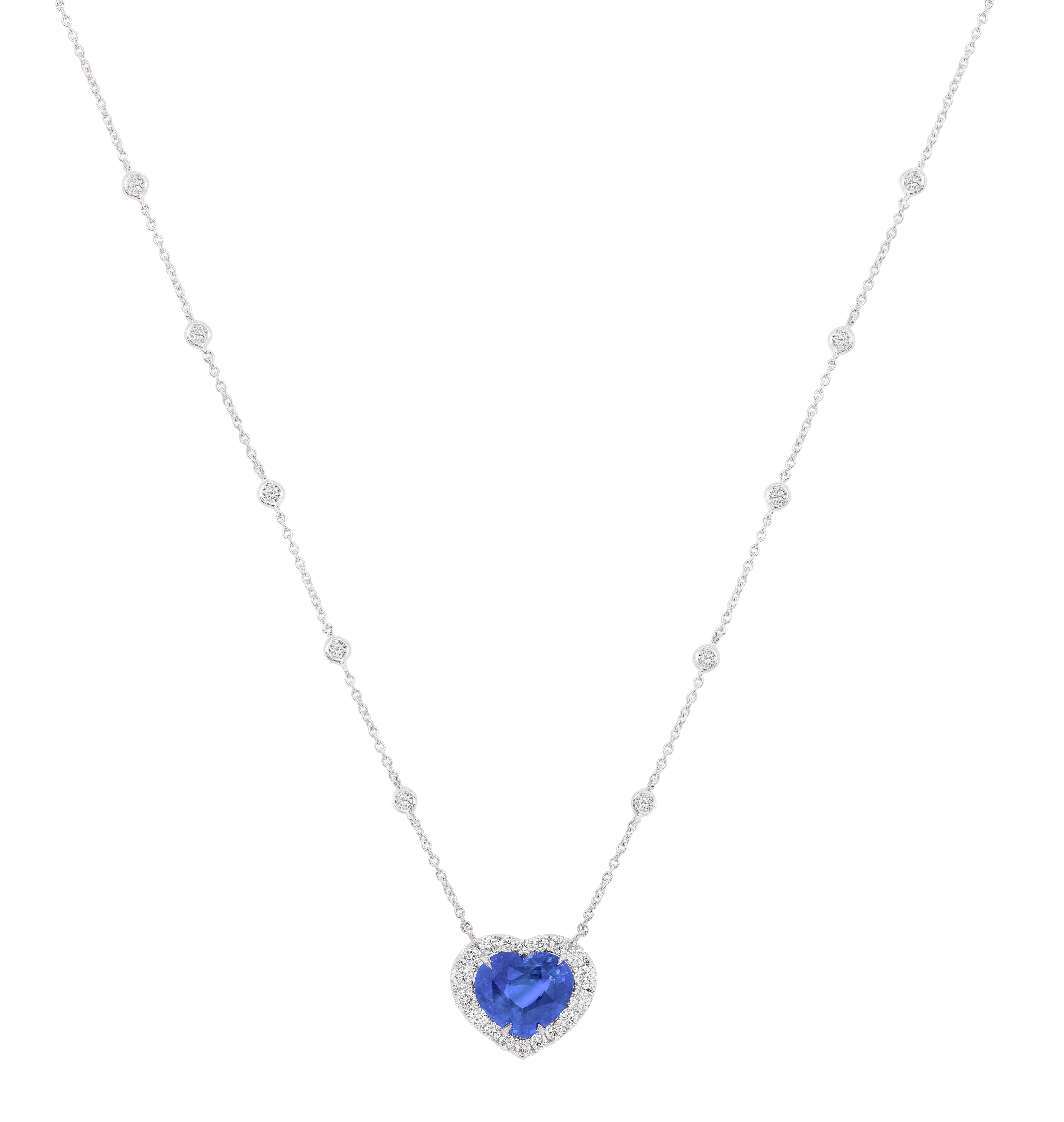 18KT White gold Certified Heart shape sapphire and diamond pendant features 6.57 Carat Sapphire surrounded by 2.00 Carats of Round Brilliant cut white diamonds. 16