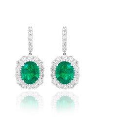 Diana M. 18KT White Gold Earrings with Oval Green Emerald & Round White Diamond
