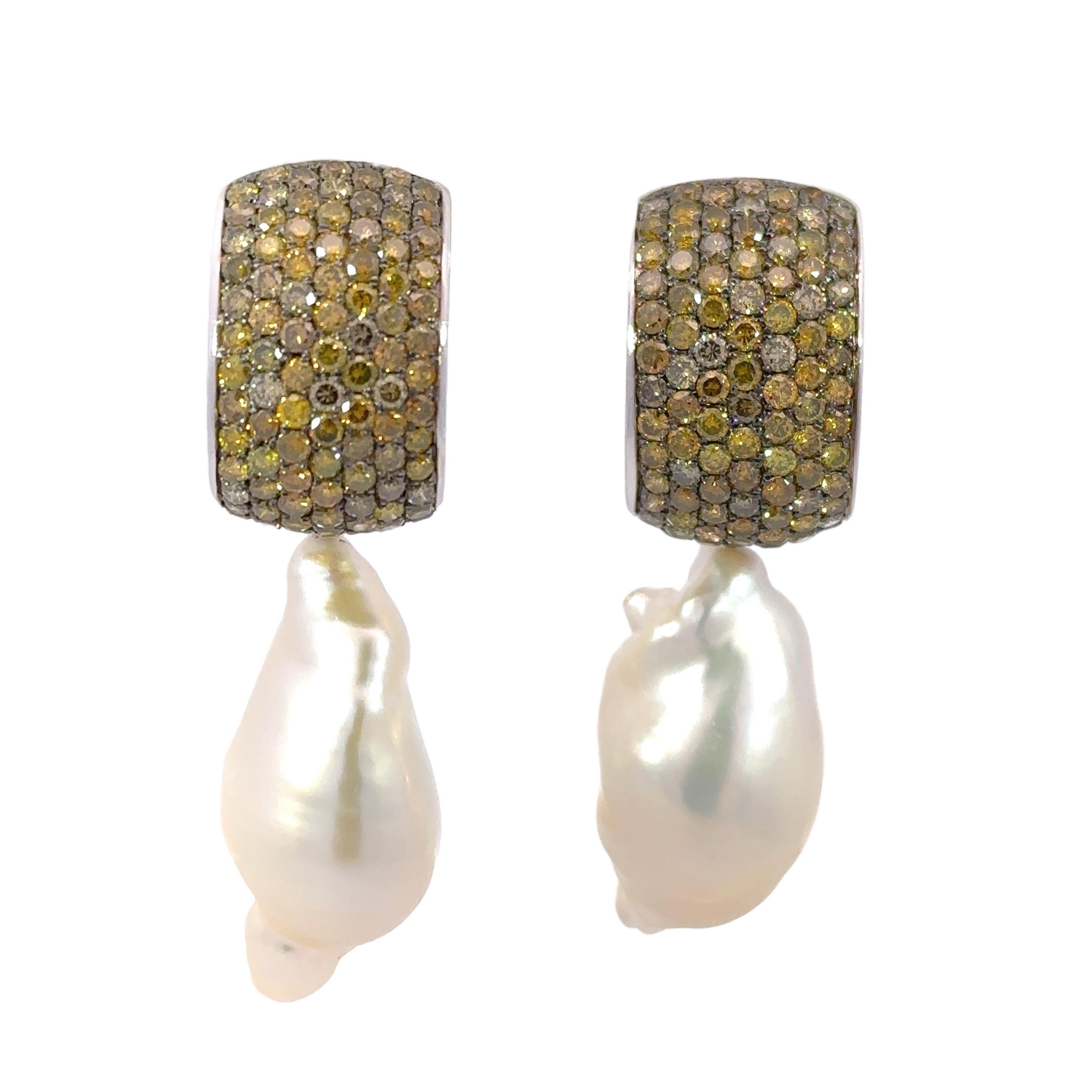 Amazing 18kt White Gold Earrings With Yellow/Cognac Diamonds and a Removable Pearl

When purchasing earring it comes with a set of removable pearls but 3 additional Options of Removable pieces available for purchase, See attached photographs, Please