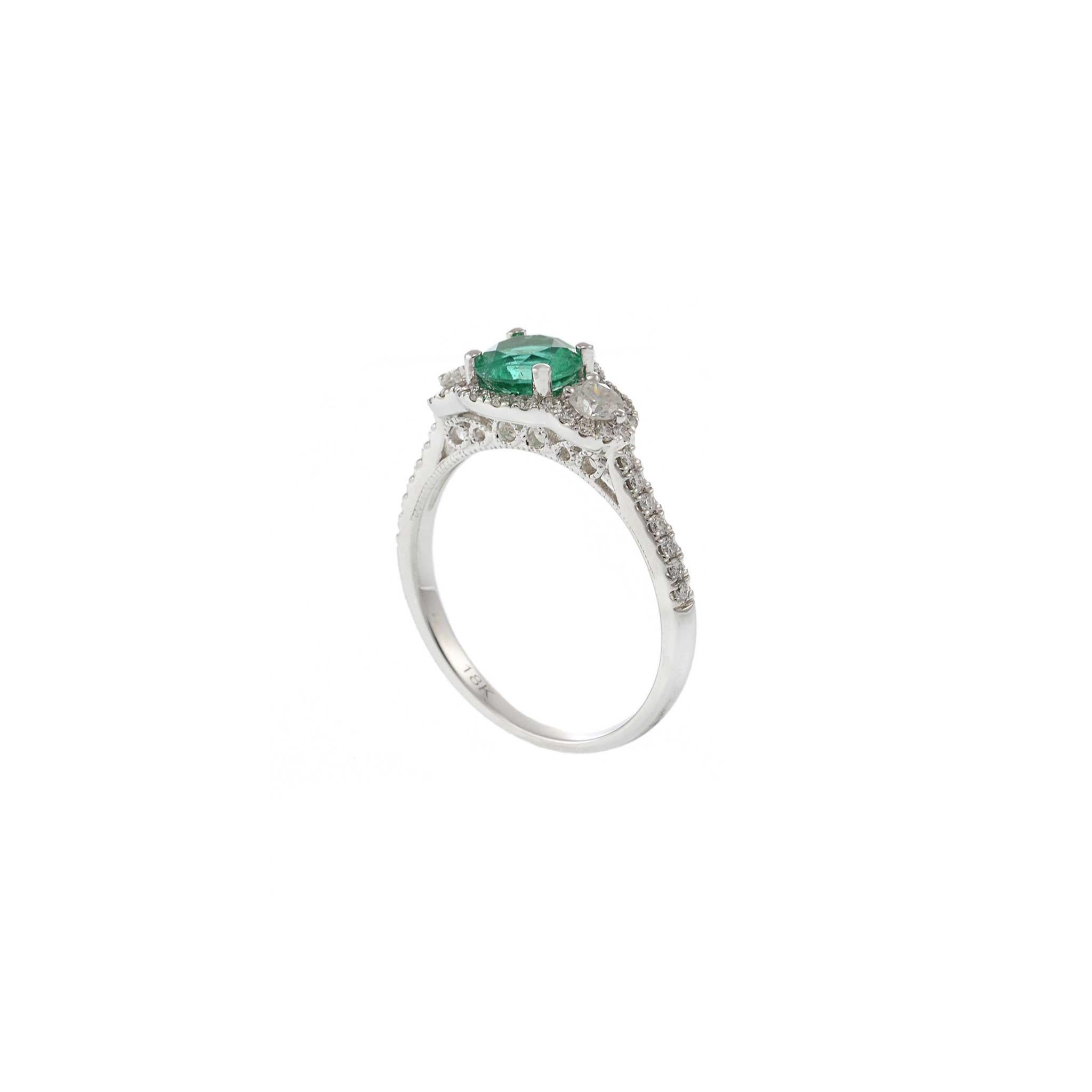 Modern 18KT White Gold Emerald and Diamond Ring For Sale