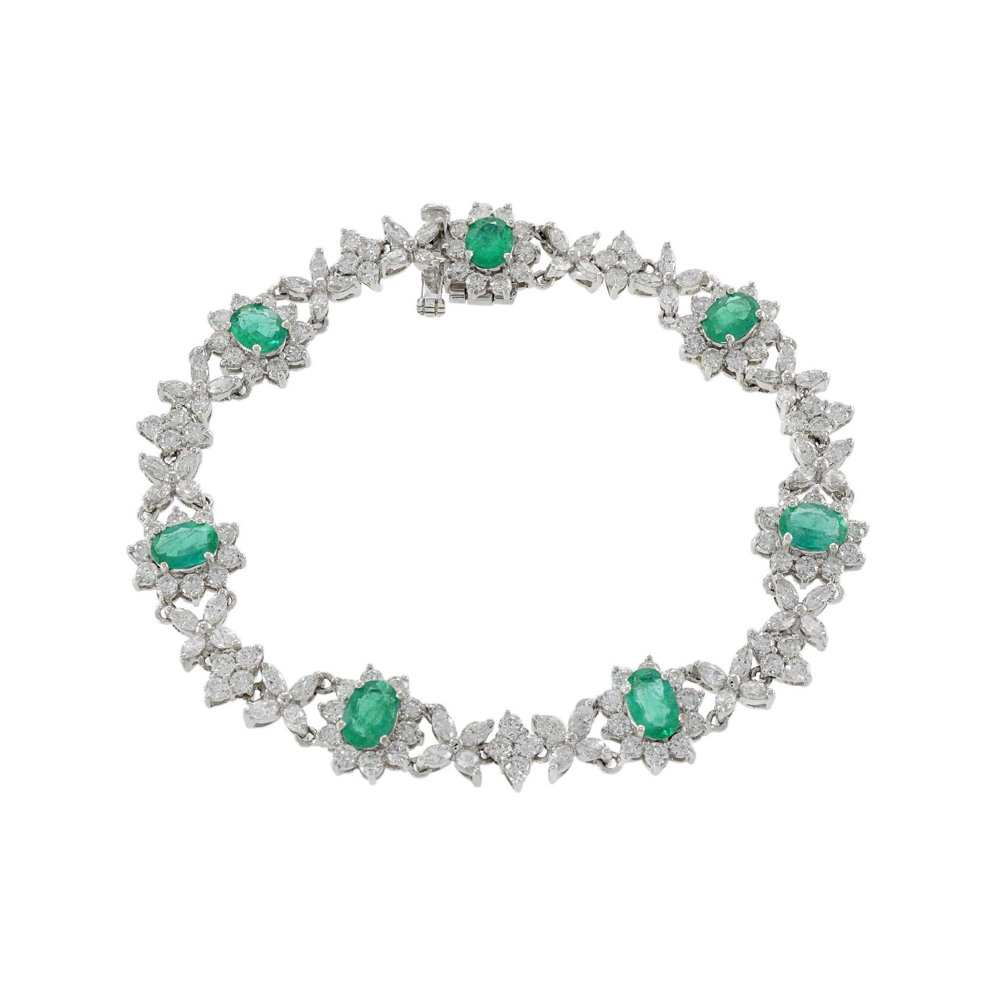 The emeralds (2.87ct tw) steal the show in this 18kt white gold bracelet. They are surrounded by G-color, VS2 diamonds that also elegantly join the emeralds as they are arranged in diamond and flower shapes. This bracelet is certified.