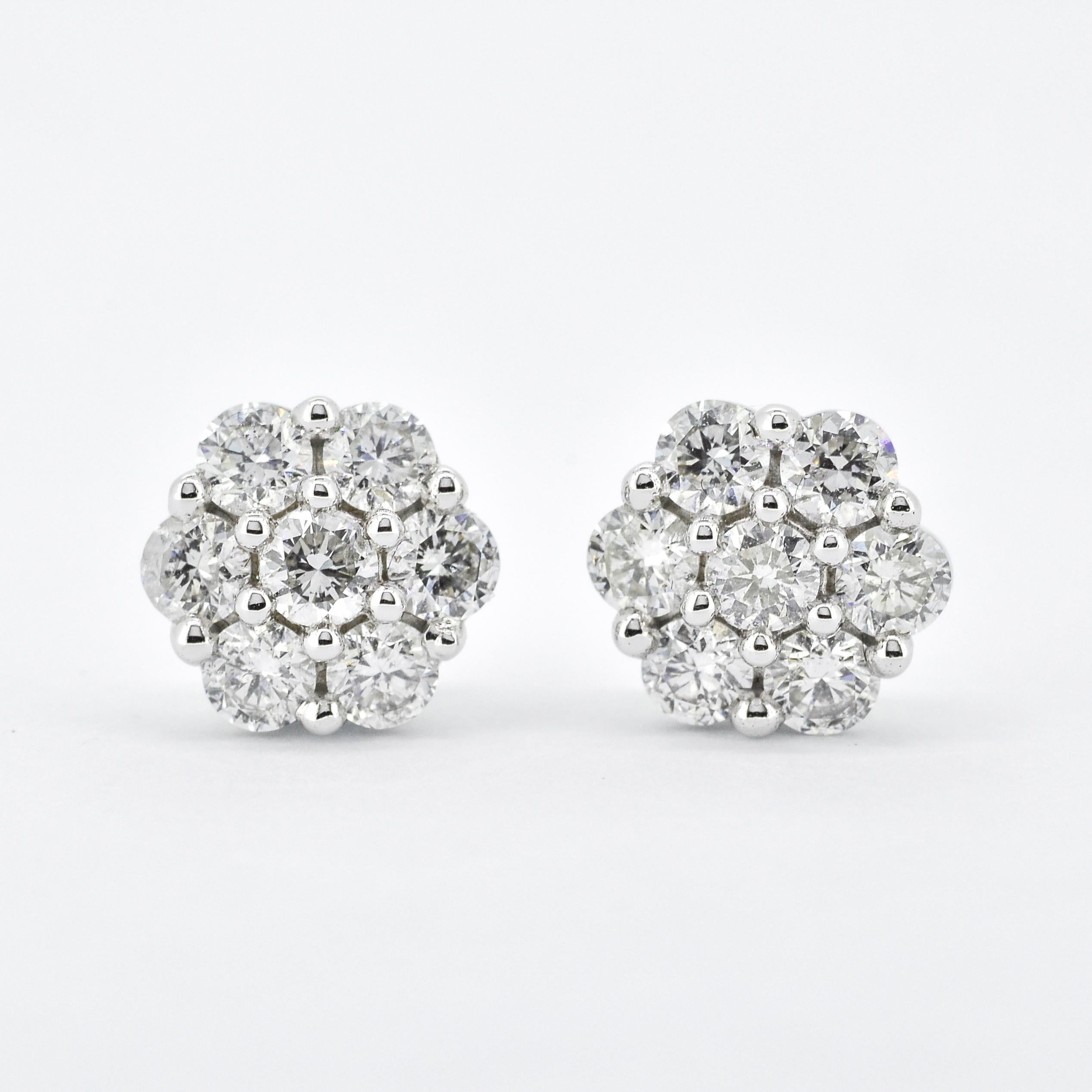 Introducing our exquisite 18kt white Gold ethically sourced natural diamond cluster stud earrings. These earrings offer a timeless and classic look that effortlessly transitions from daytime to nighttime, ensuring elegance at every moment.

Crafted