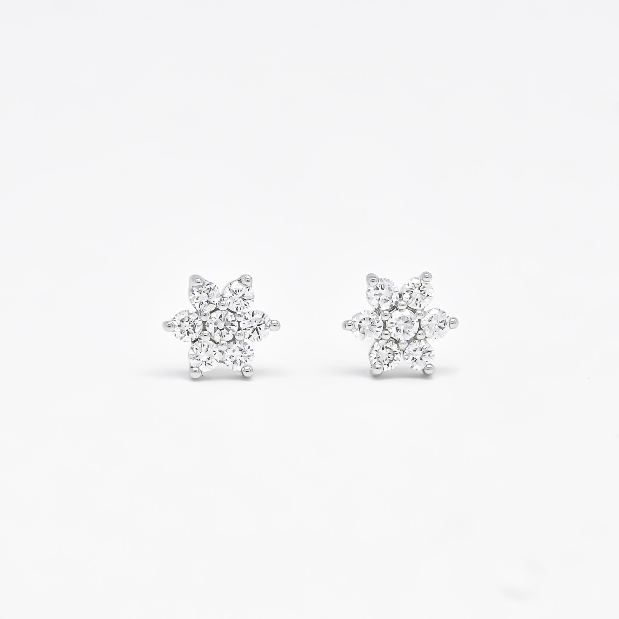 Indulge in the understated beauty of our 18Kt white gold simple and minimalist natural diamond flower shape cluster earrings—an exquisite gift for your beloved daughter, mother, or even for yourself. Meticulously crafted to capture the essence of