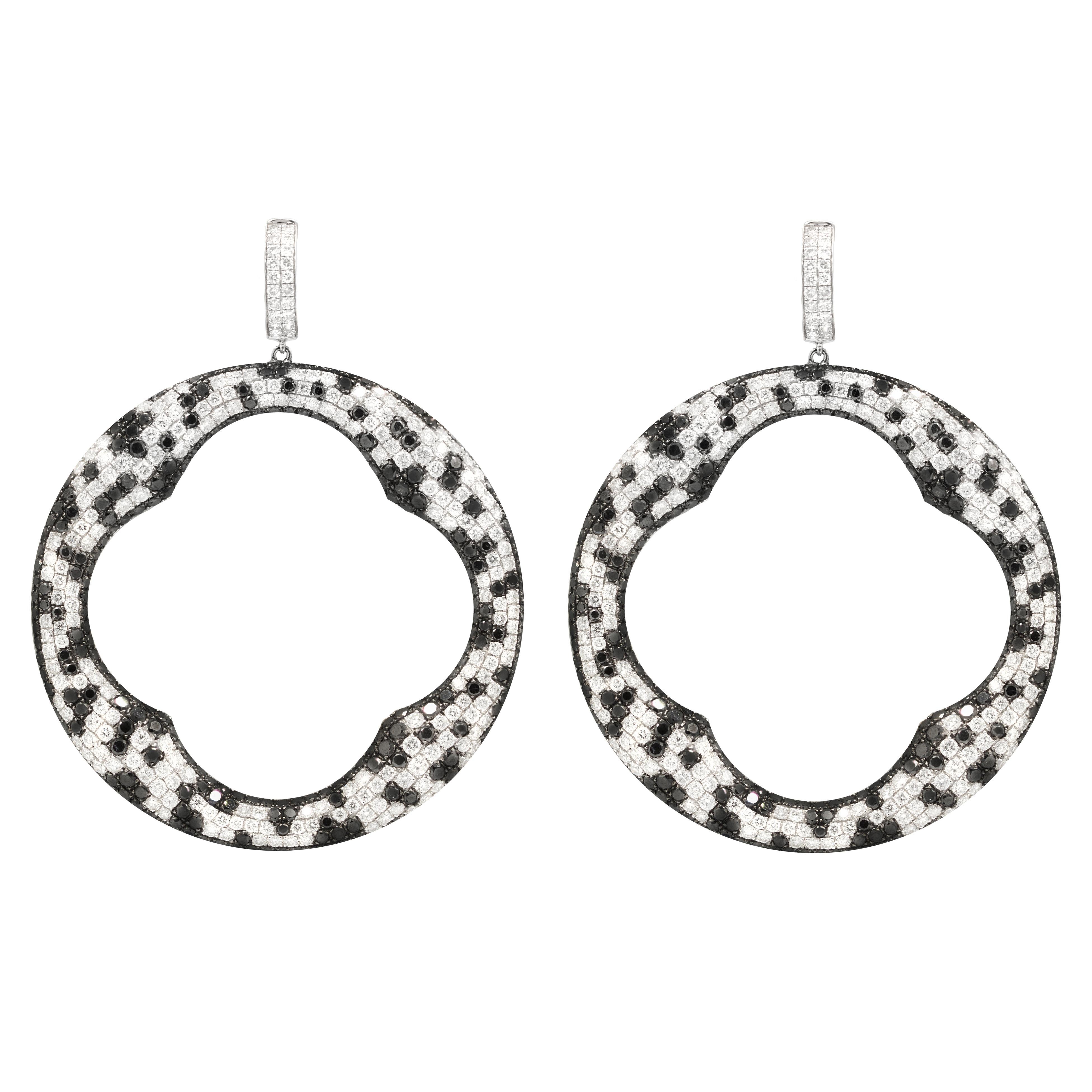 18kt white gold, black and white diamond fashion earrings, features 25.00 carats of diamonds. 
