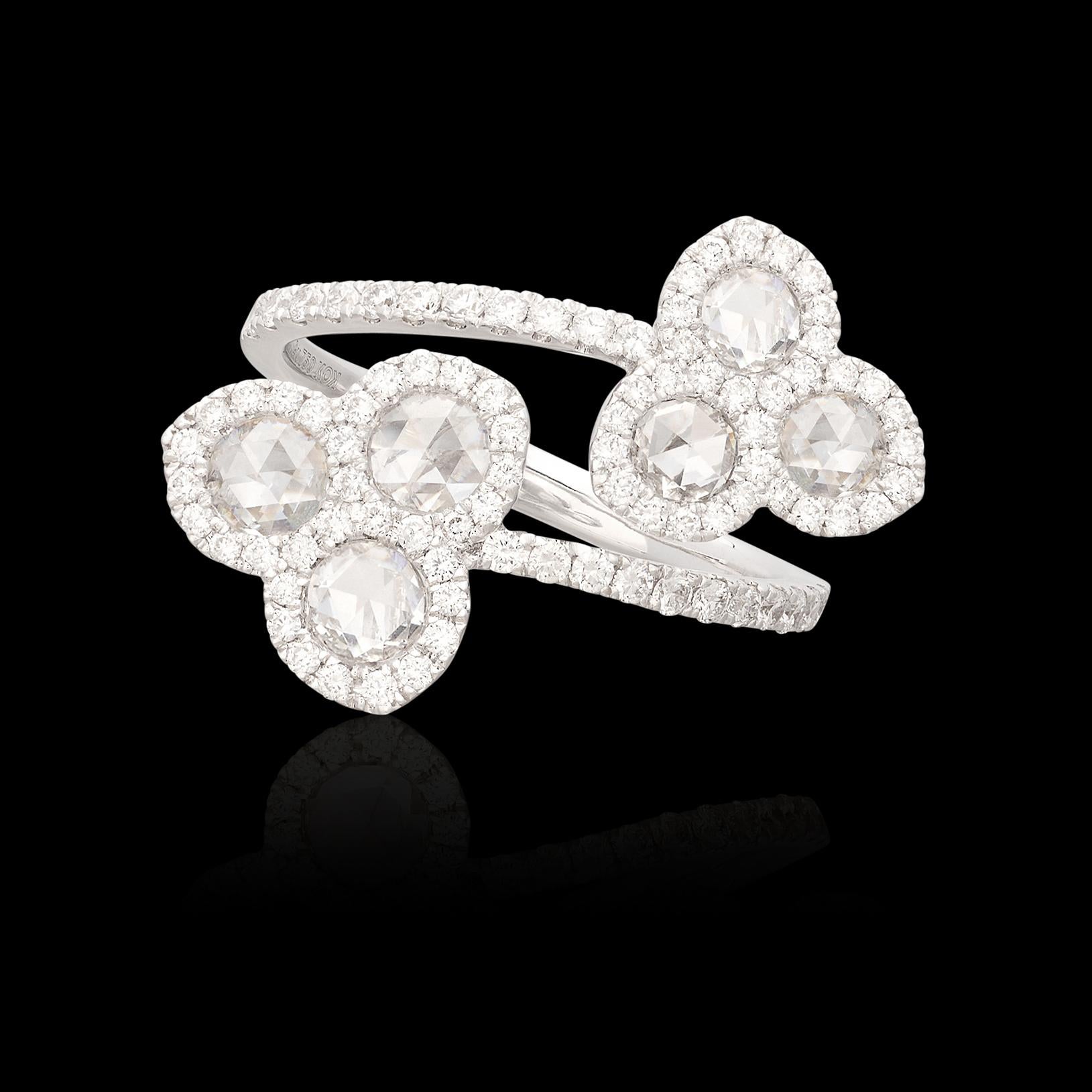 Pure elegance! This 18 karat white gold floral bypass ring features 6 sparkling rose cut diamonds expertly set amongst beautiful round brilliant melee cut diamonds for a total diamond weight of 1.42 carats. The diamonds are wonderfully well matched
