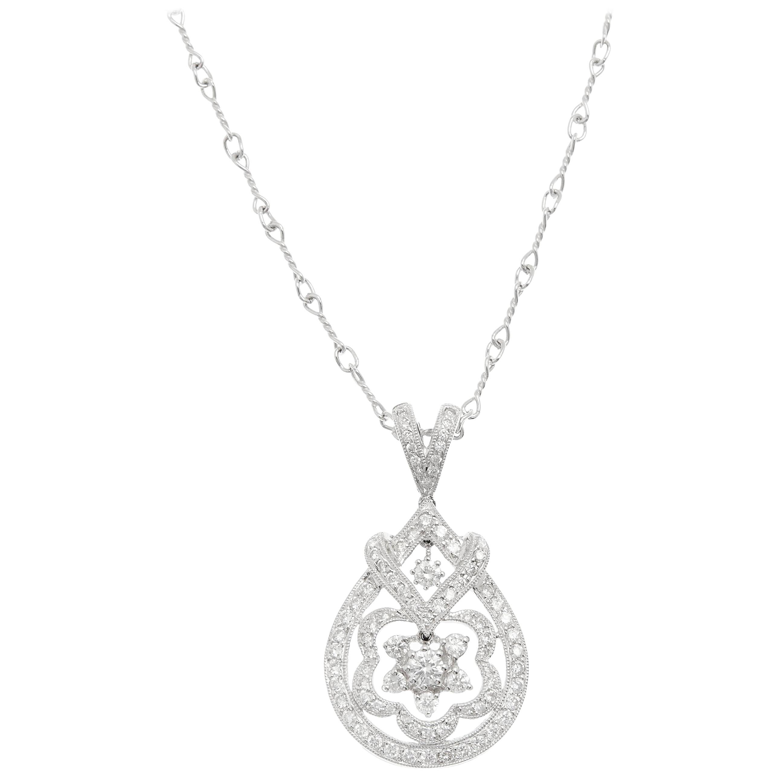 18kt White Gold Floral Pendant with 0.66ct of Diamonds For Sale