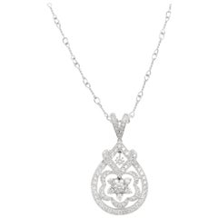 18kt White Gold Floral Pendant with 0.66ct of Diamonds