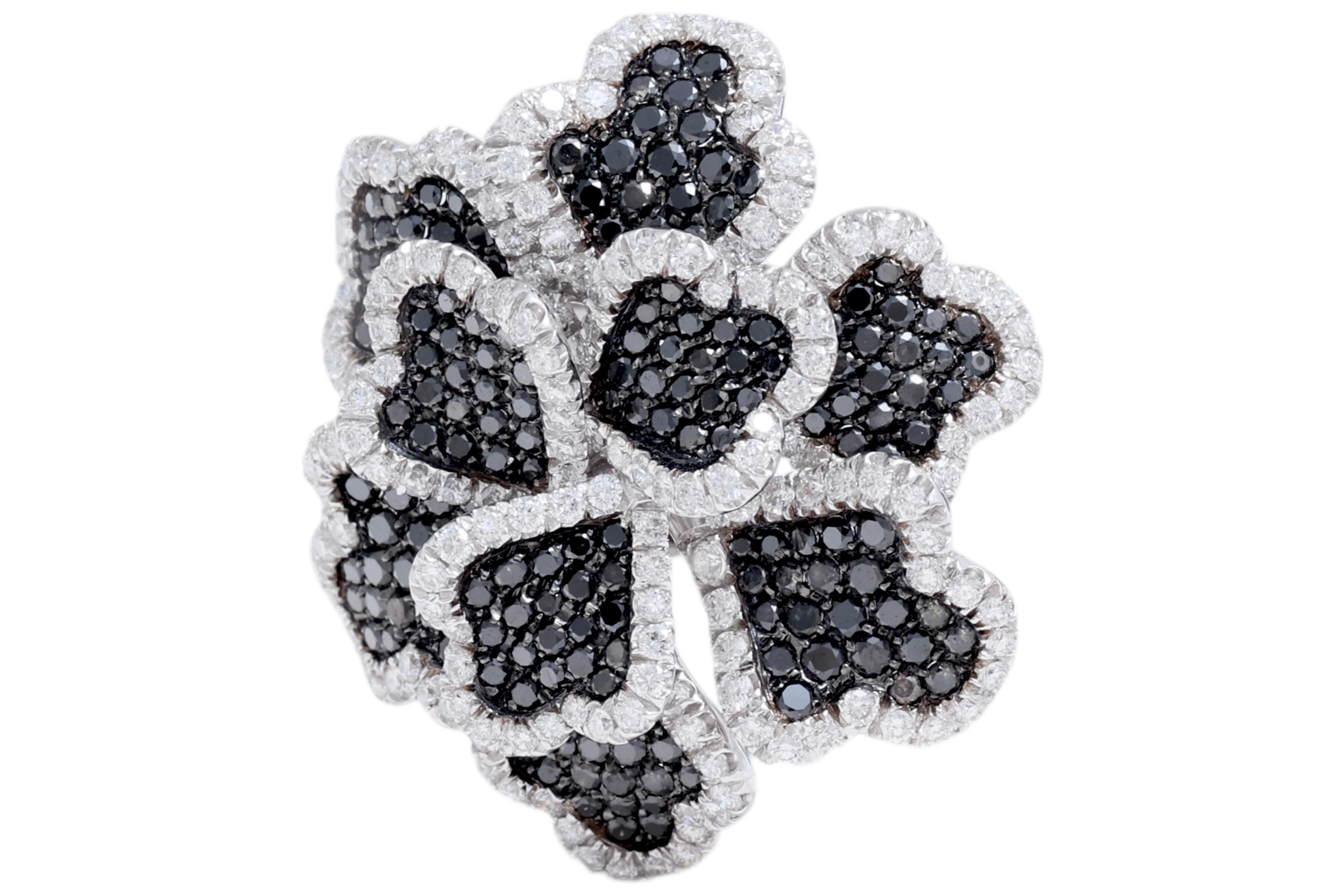 Magnificent 18kt White Gold Flower Ring With 3.13ct Brilliant Cut Diamonds, 3.35ct Black Diamonds

Brilliant cut diamonds: together 3.13ct

Black diamonds: together 3.35ct

Material: 18kt white gold

Total weight: 20.7 gram / 0.730 oz / 13.3