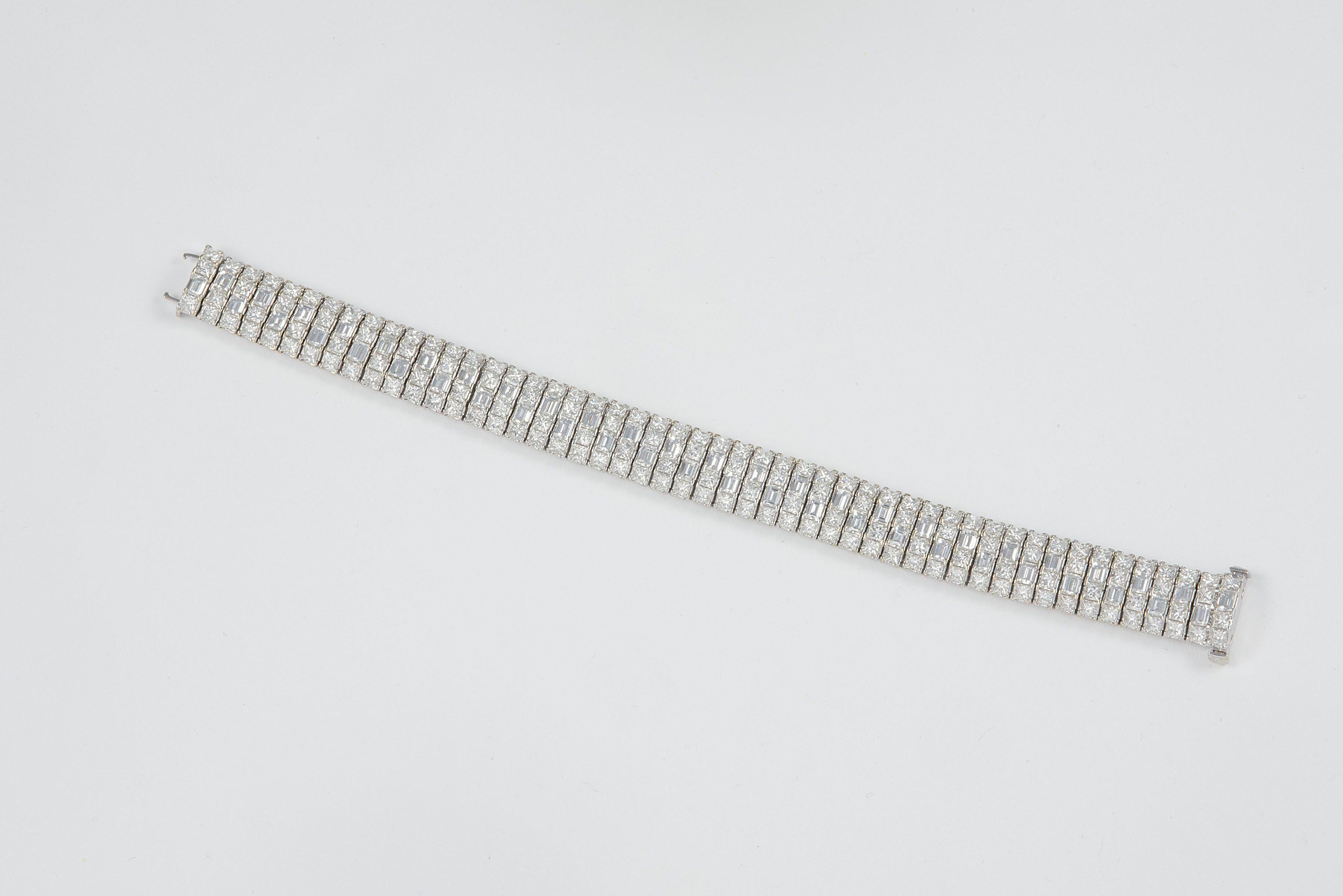 This exquisite custom made link bracelet handcrafted in 18kt white gold features four rows of alternating princess-cut and baguette diamonds totaling 19.32 carats, H-I color, VS clarity.
