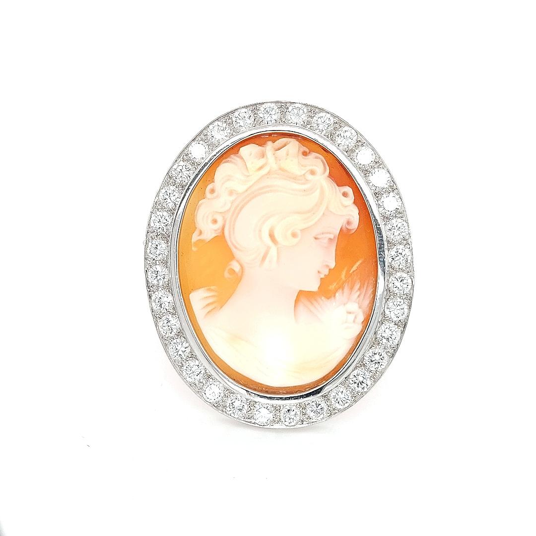 In an openwork 18K white gold cadre, a meticulously carved hard stone cameo  within this French Victorian style brooch with security chain.

No detail has been spared to enrich this classical jewel.

Material: 18kt solid  white gold

Measurements: