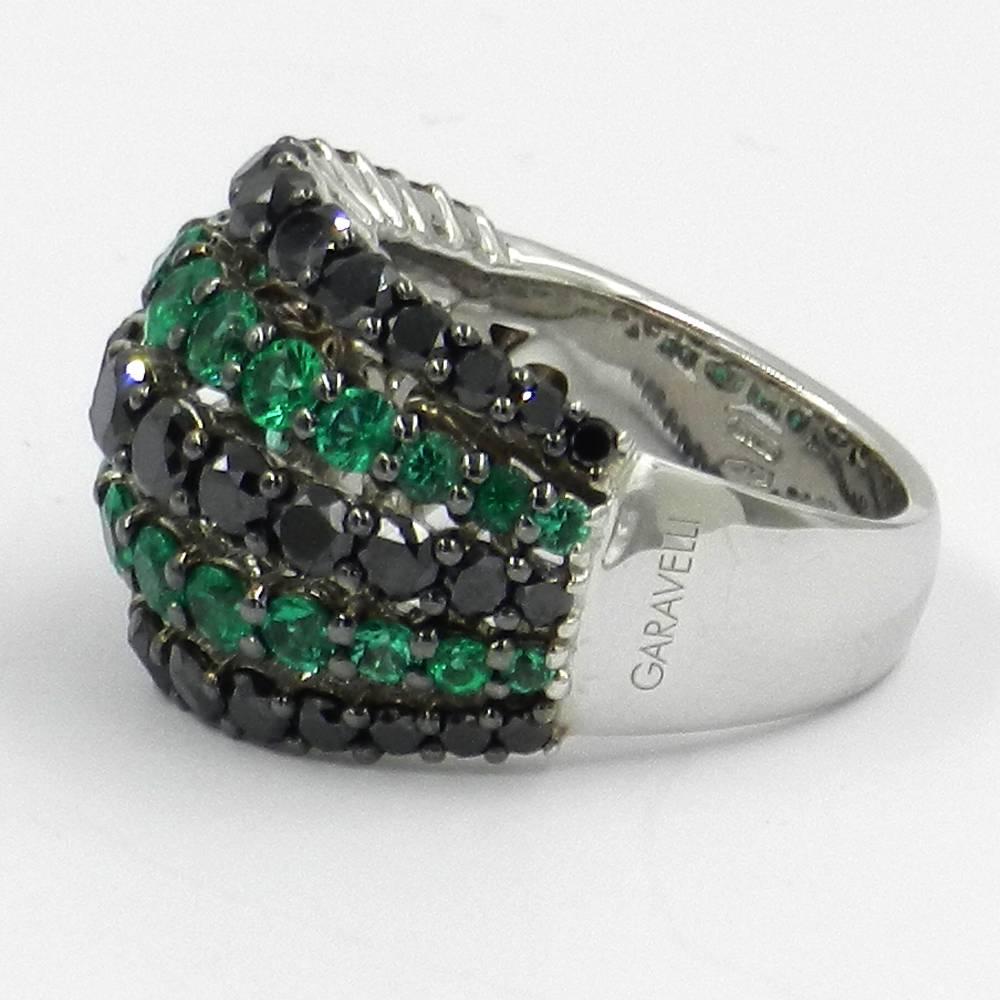 18KT White Gold GARAVELLI  RING With BLACK DIAMONDS And  EMERALDS 
finger size 54
GOLD  : 11,70
BLACK DIAMONDS ct : 2,98
NATURAL EMERALD  ct. : 1,55