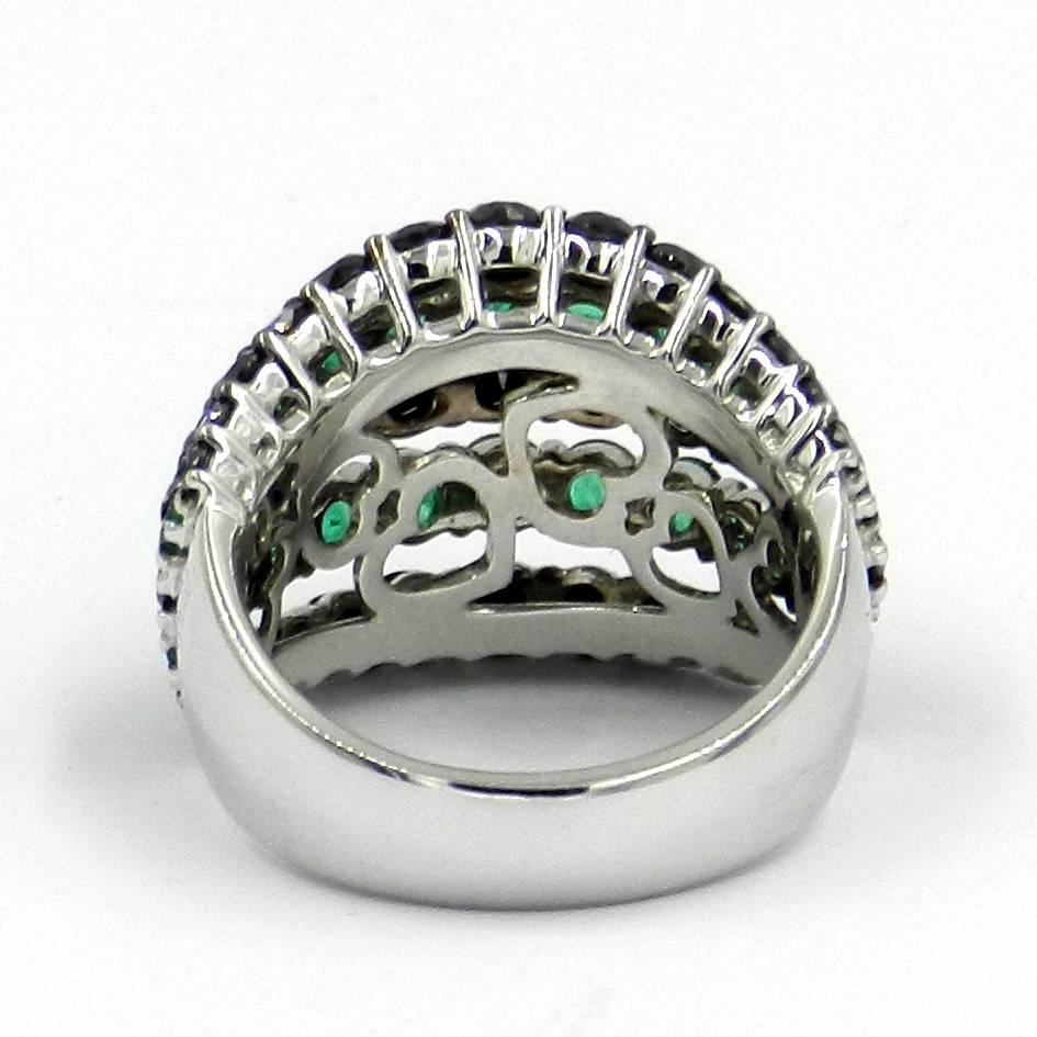 Round Cut 18 Karat White Gold Garavelli Ring with Black Diamonds and Emeralds For Sale