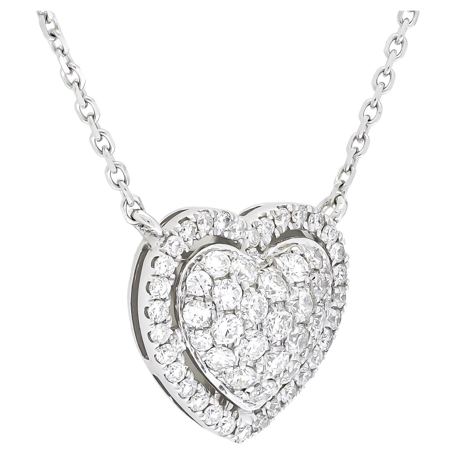Embrace the brilliance of a true showstopper with this dazzling heart-shaped diamond cluster in a halo pendant necklace. The necklace boasts a sumptuous 0.55 carats of glittering diamonds, ensuring every glance in your direction is captivated by the