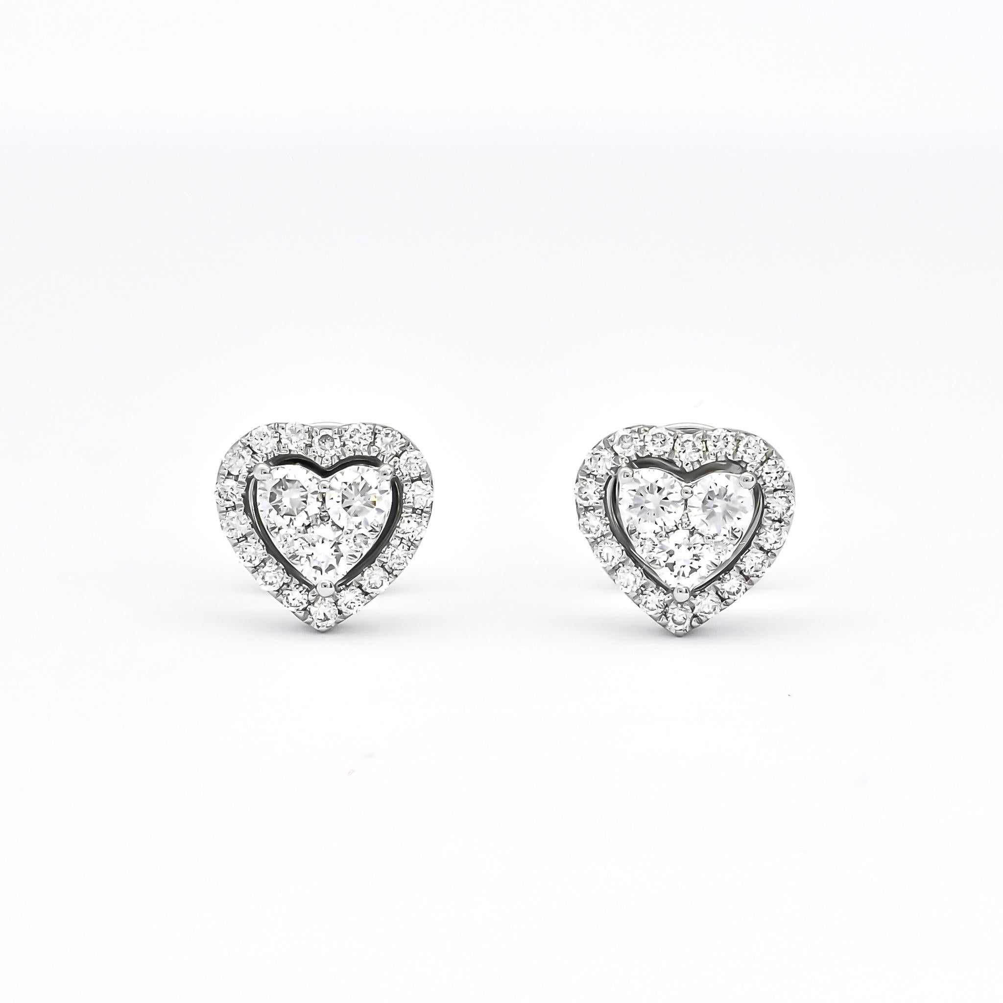 These 18KT white gold heart-shaped cluster diamond with halo stud earrings are a dazzling pair of earrings that are perfect for any occasion. Each earring features a heart-shaped cluster of high-quality diamonds that are set in a halo of smaller
