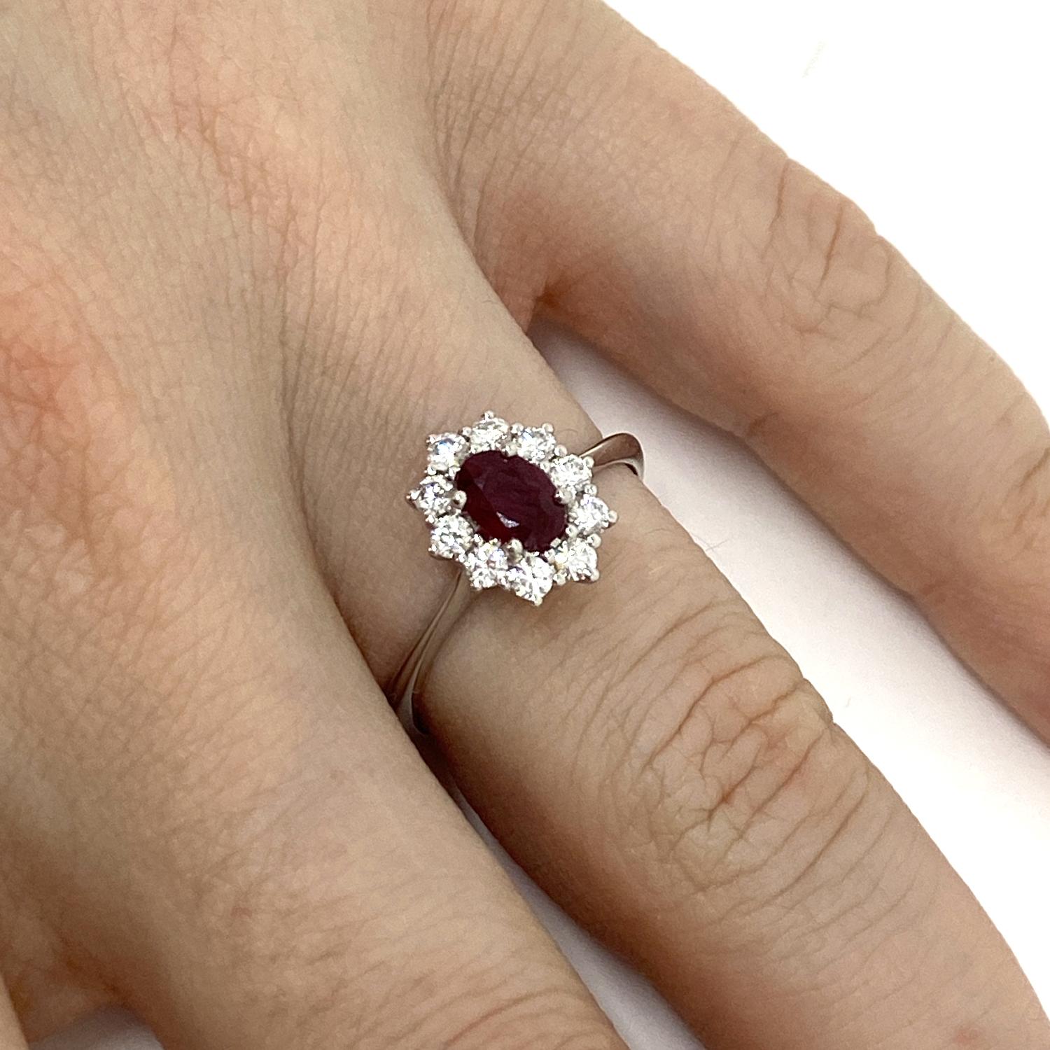 Ring made of 18kt white gold with natural oval-cut ruby for ct.0.41 and brilliant-cut white natural diamond surround for ct.0.32 color D/E SI
-------------------------------------------------

Important Note : In order to speed up the publishing