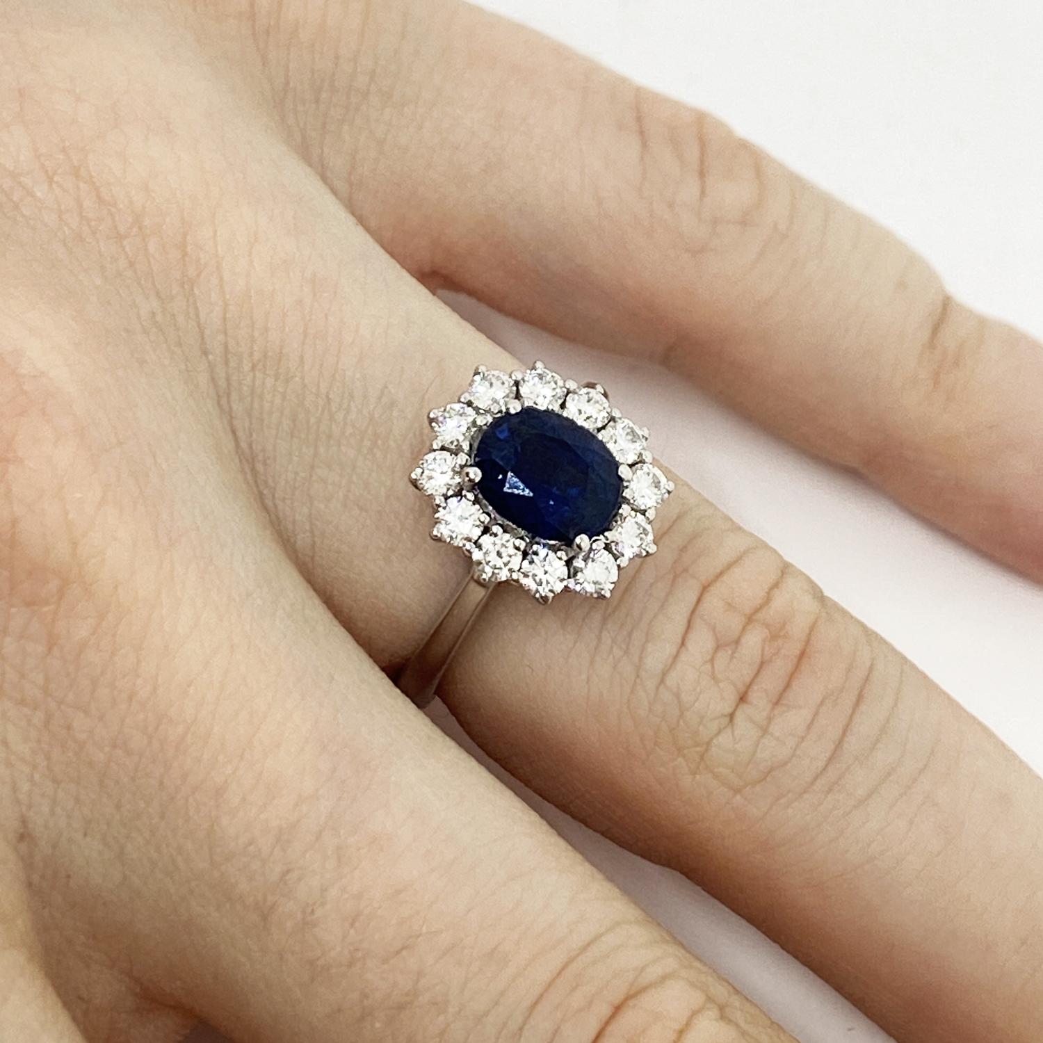 Ring made of 18 kt white gold with central oval-cut natural sapphire for ct.1.62 and natural white brilliant-cut diamonds for ct.0.63
-------------------------------------------------

Important Note : In order to speed up the publishing process of