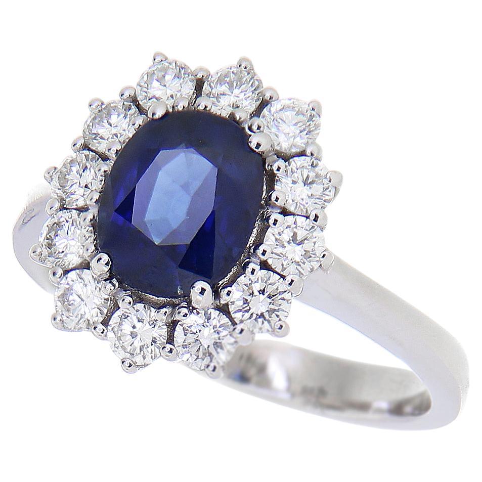 18kt White Gold "Kate" Ring 1.62 Ct Oval Cut Blue Sapphire 0.63 Carat Diamonds For Sale