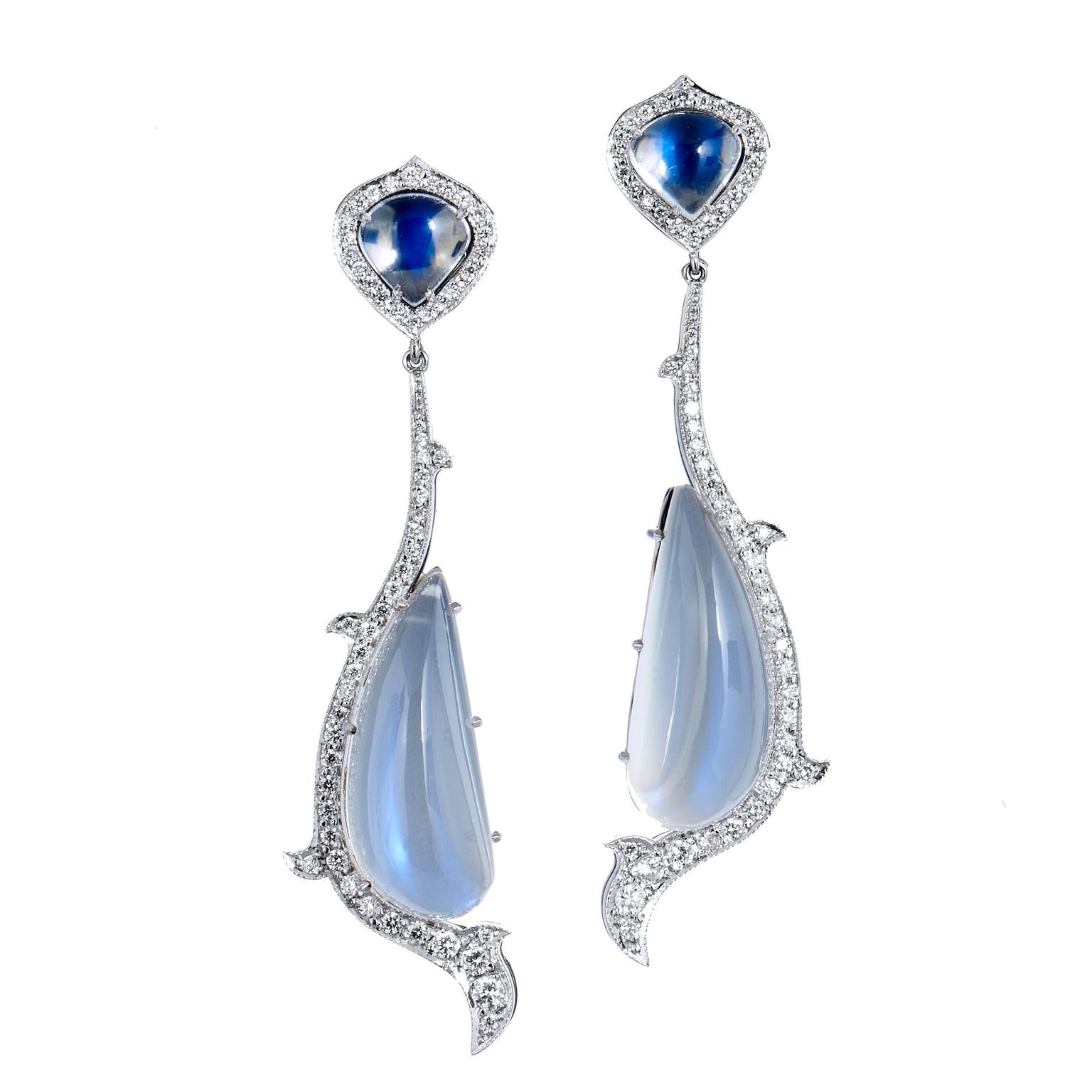18kt White Gold Moonstone and Diamond Drop Earrings Handmade 

Known for its enchanting dance with light, the moonstone is a playful and intriguing stone that translates beautifully into jewelry design. Handmade in 18kt white gold, this set of