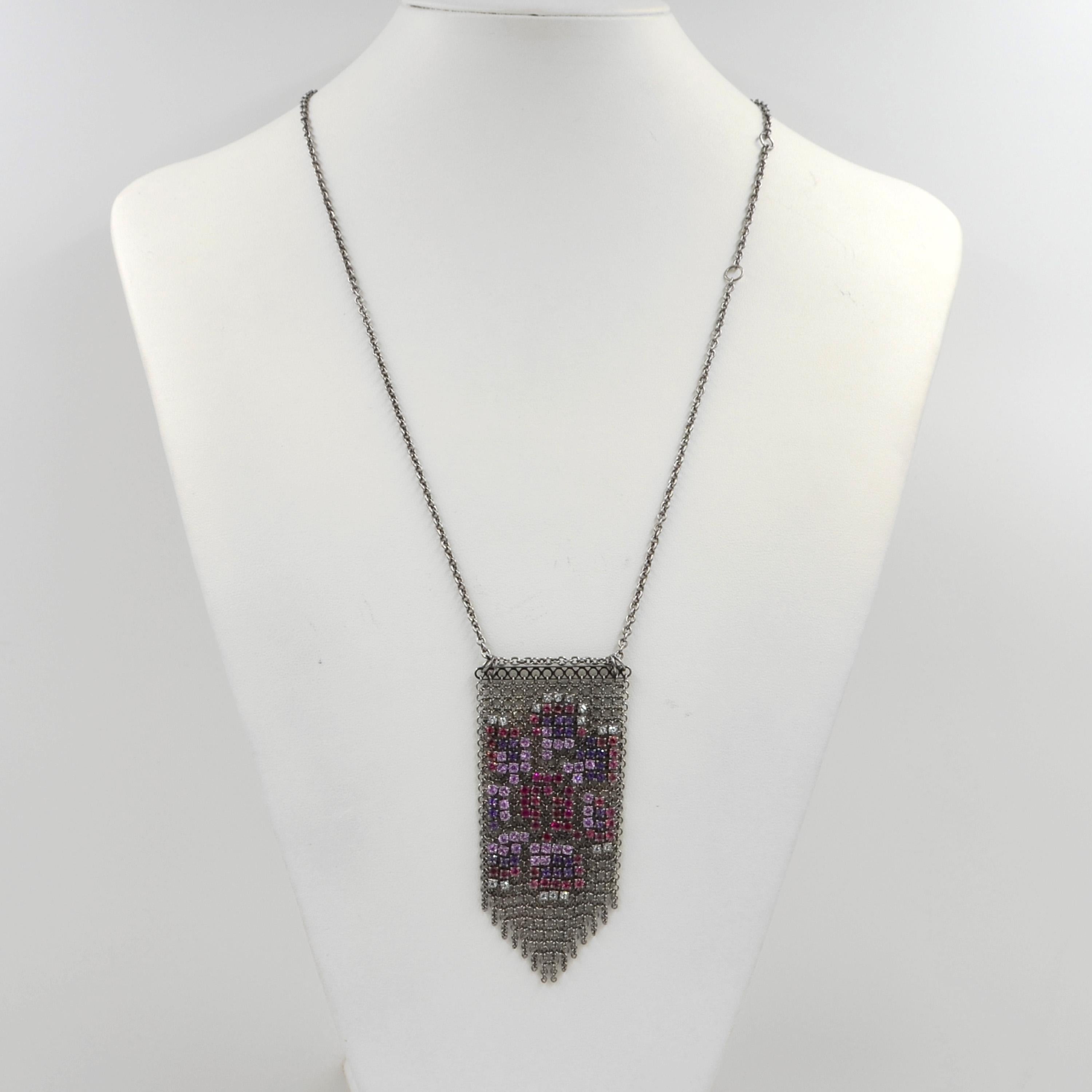 18KT White Gold Multicolor Precious and Semiprecious  Garavelli Soft Pendant Necklace : 
 WHITE TOPAZ, PINK TOURMALINE, PINK SAPPHIRES, AMETHYST AND RUBIES
Pendant size cm 8 x 4
Chain lenght cm 60 with a loop at 55, at 50, at 45 and at 40 cm
18 KT