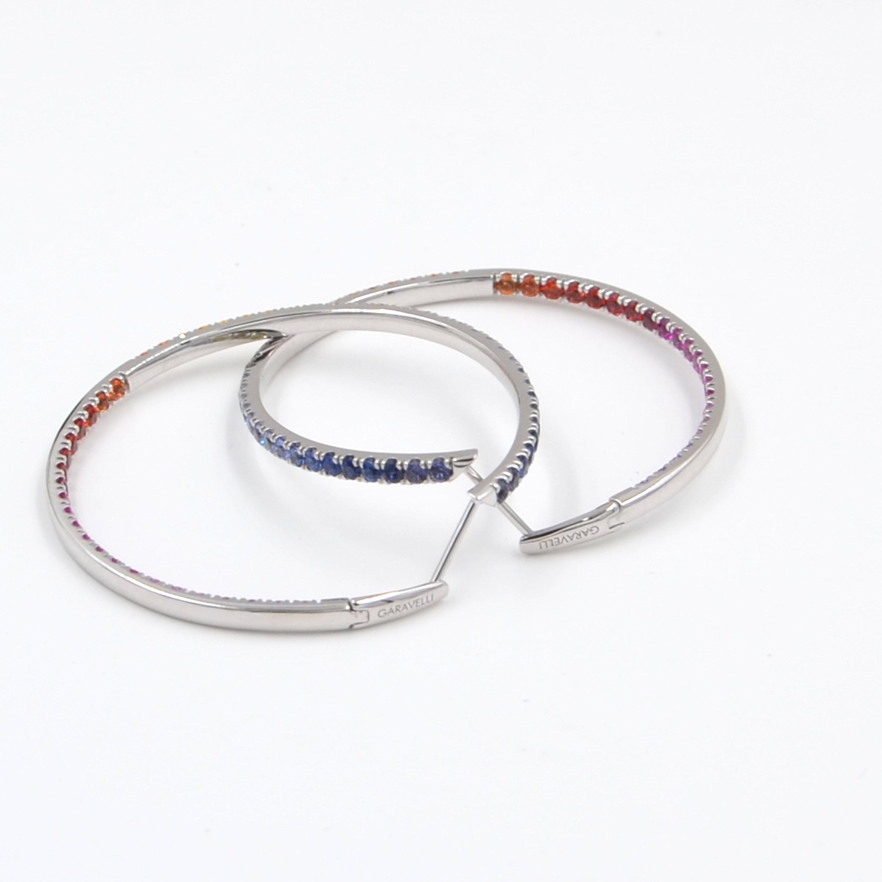 18KT White Gold Multicolor Sapphires Garavelli Large Hoop EARRINGS 
Hoops diameter mm.45
18kt GOLD  : 15,60
RAINBOW SAPPHIRE  : ct 6,85