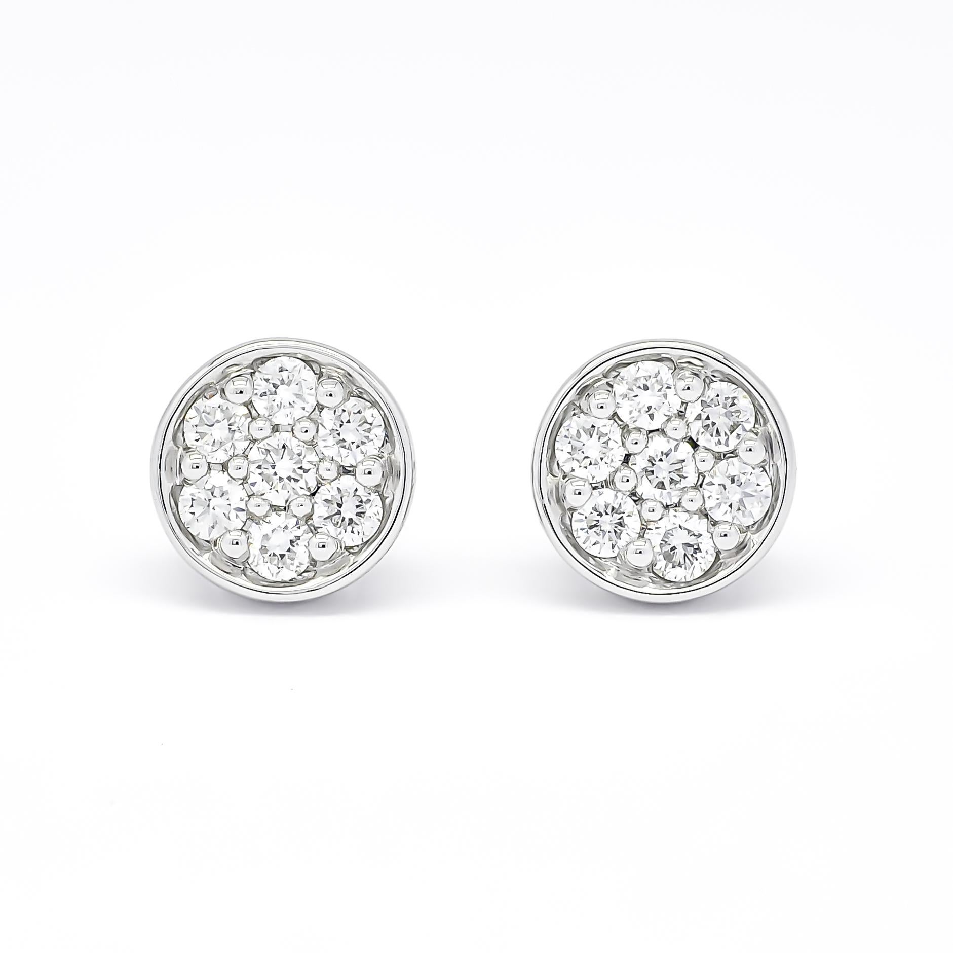 Crafted with utmost care, each earring features a delicate cluster of natural diamonds, carefully set in a bezel setting. The bezel setting not only enhances the brilliance of the diamonds but also provides a secure and sophisticated look.

Made