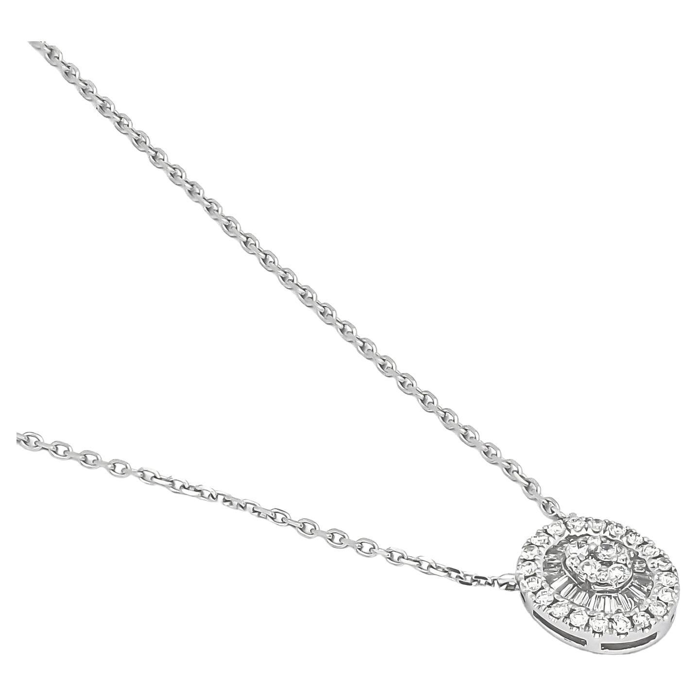 This handmade white gold pendant is enhanced with a round diamond cluster and accented with shimmering baguette diamonds encased in a starburst pattern, creating a look that is both sophisticated and eye-catching.

The pendant is expertly crafted