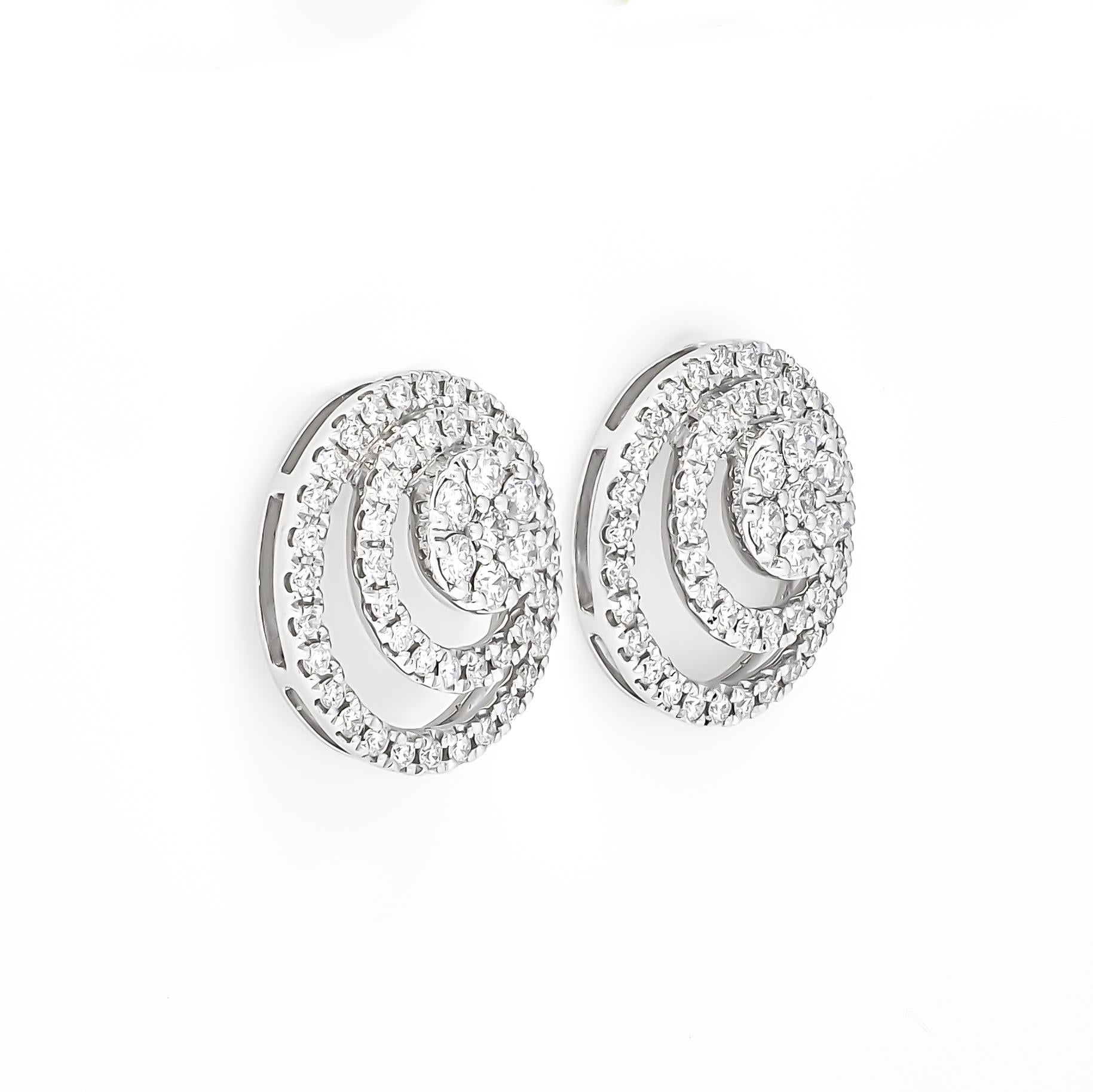
These stunning earrings are a harmonious blend of timeless elegance and modern sophistication. Crafted with precision, they feature a captivating floral cluster design, beautifully encrusted with shimmering diamonds. The double halo adds an extra