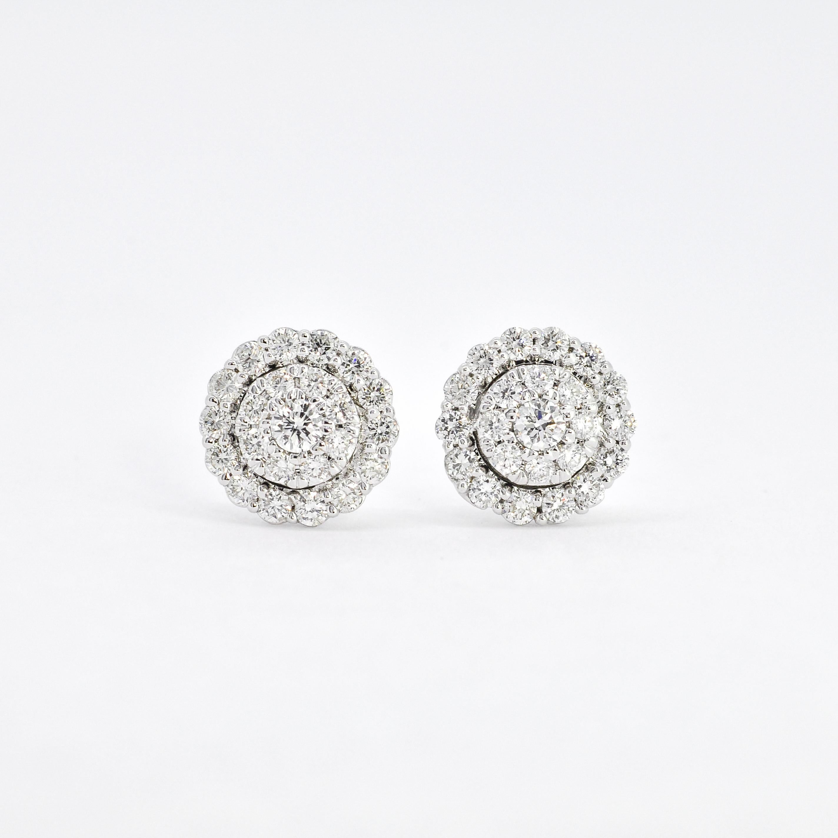 Round diamond cluster white gold double halo earrings are a stunning example of vintage-inspired jewelry with a timeless and elegant design. These earrings features a round-cut diamond in the center, surrounded by two halos of smaller diamonds set
