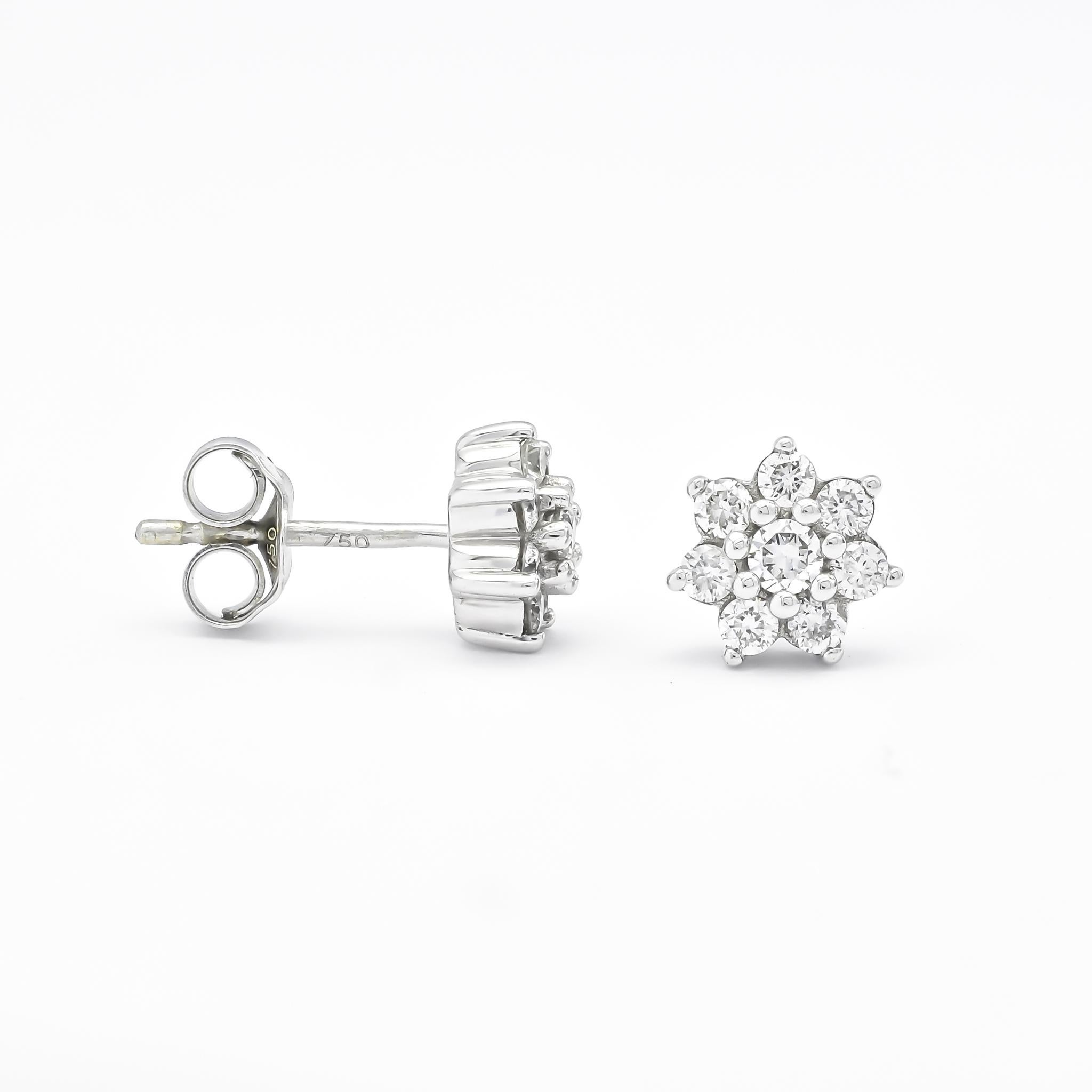 Get ready to add serious sparkle to your ears with these stunning floral stud earrings! These earrings are made with 18KT white gold and feature natural diamonds, epitomizing elegance and luxury. The brilliant round cut of the diamonds and prong