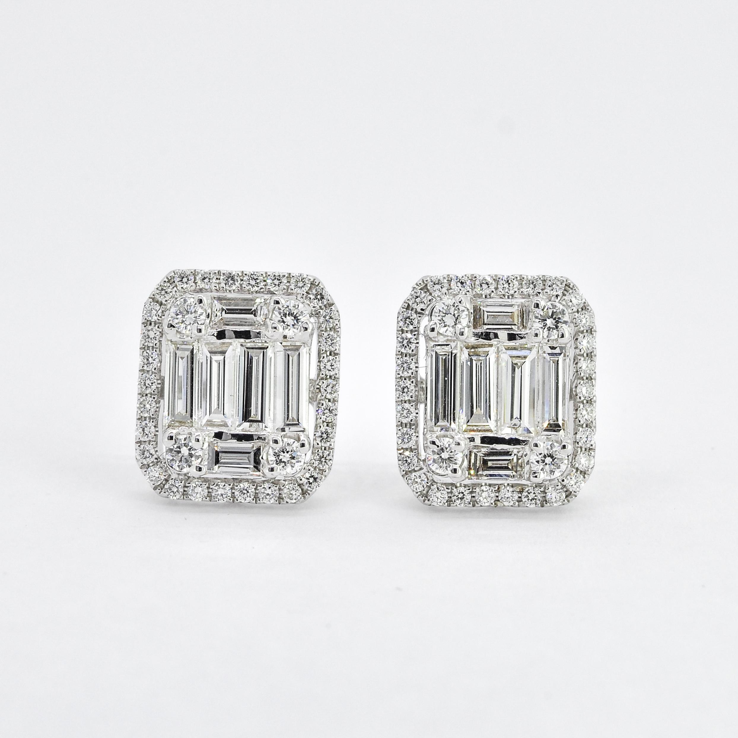 Introducing these luxurious 18KT White Gold stud earrings, featuring a diamond halo of natural diamonds with baguette cut illusion cluster center. These earrings are handcrafted to perfection and designed to add a touch of elegance to any outfit.